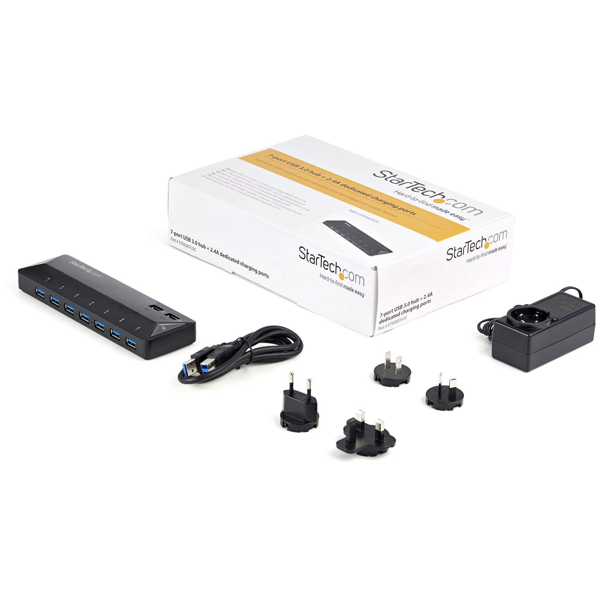 USB-Hub mit Box, Netzteil und verschiedenen Steckern. Schwarzer Hub mit mehreren Anschlüssen. Weißer Hintergrund.