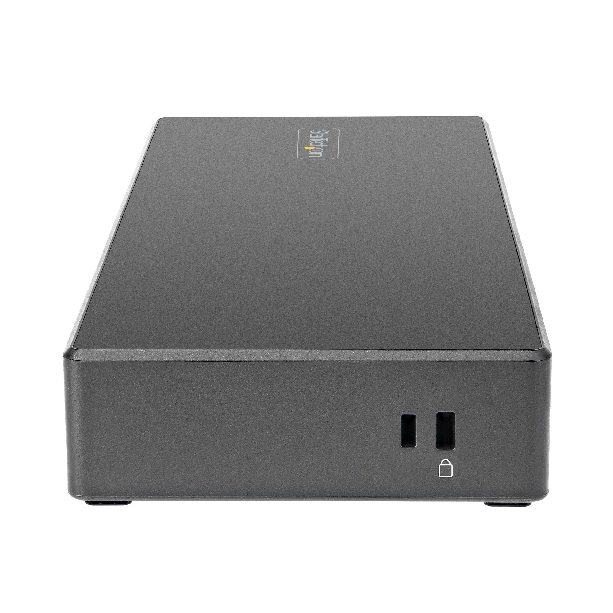 Un dispositivo rectangular gris oscuro con dos puertos USB y una entrada de alimentación, fondo blanco.