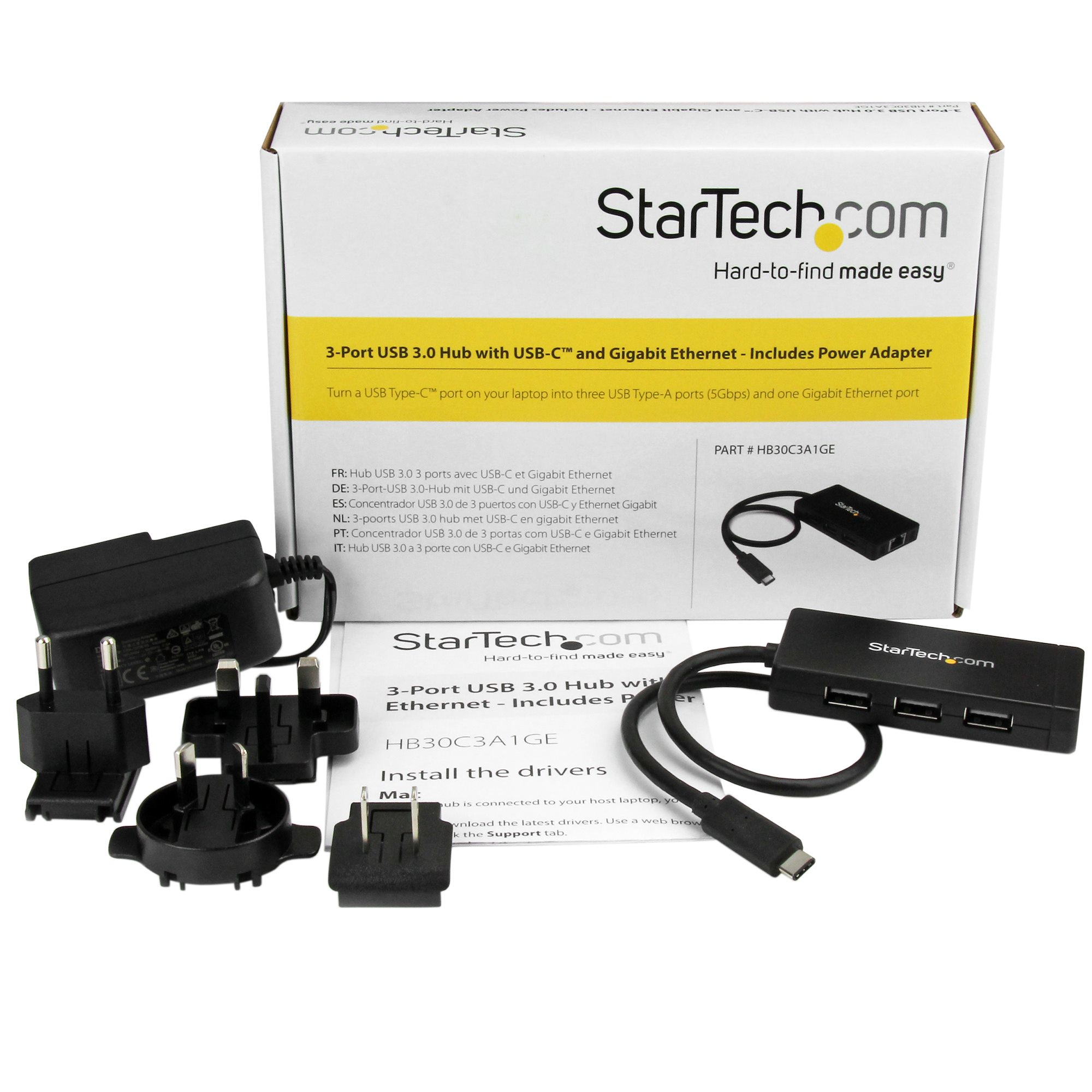 Una caja de producto con un concentrador USB, adaptadores de corriente y cables. La caja tiene información del producto.