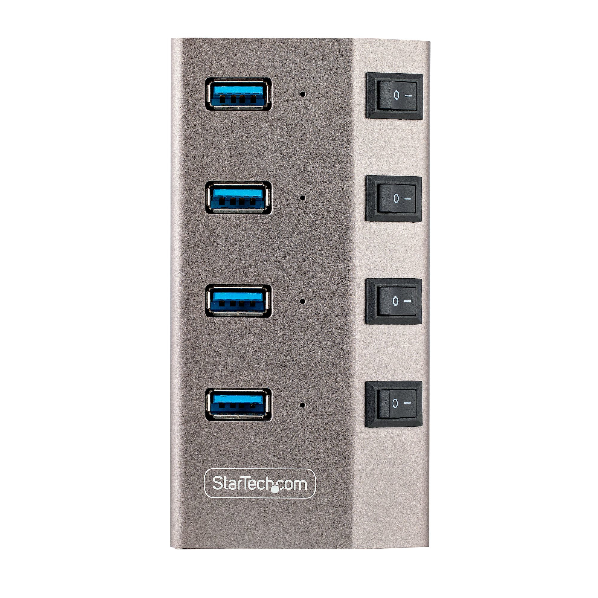 Ein grauer USB-Hub hat vier USB-Anschlüsse und vier Ein-/Ausschalter. Die Marke 'StarTech.com' ist sichtbar.