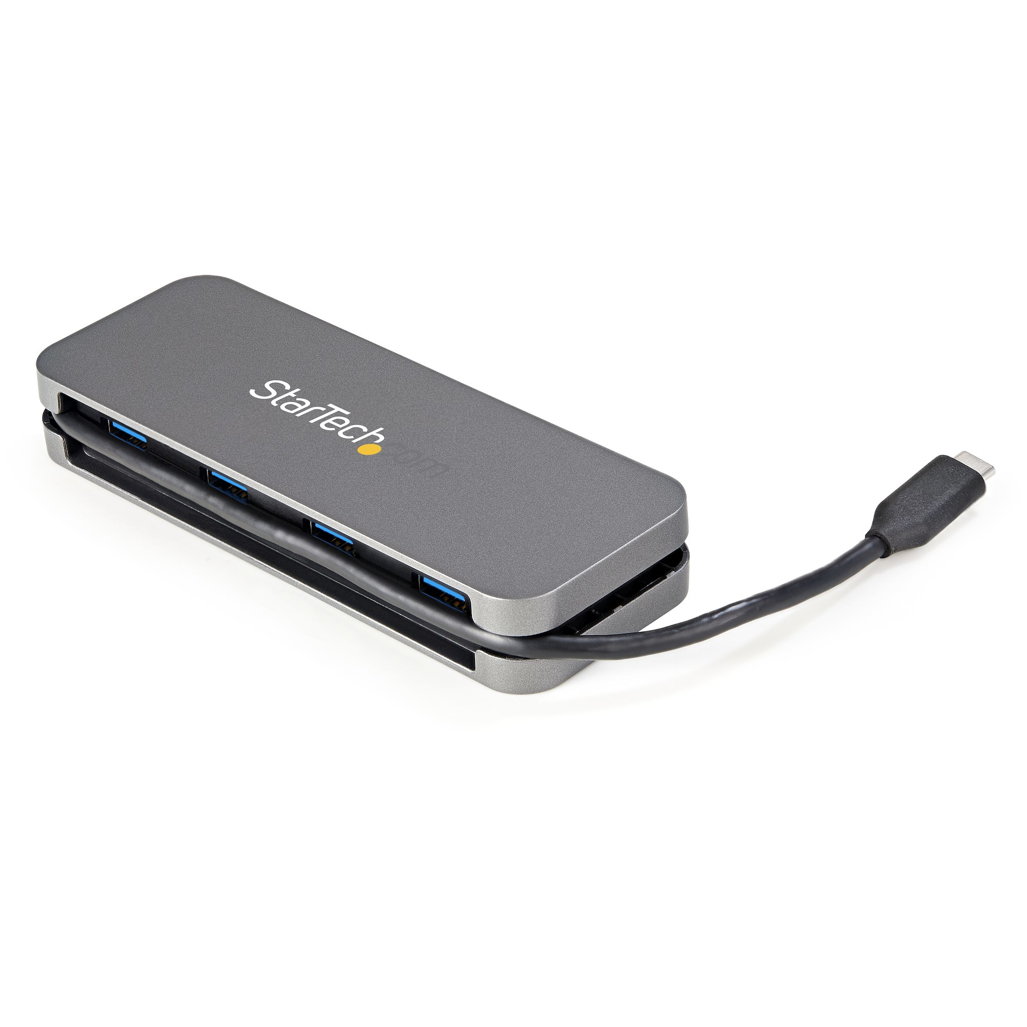 Un concentrador USB gris con cuatro puertos. El concentrador tiene un cable negro adjunto.