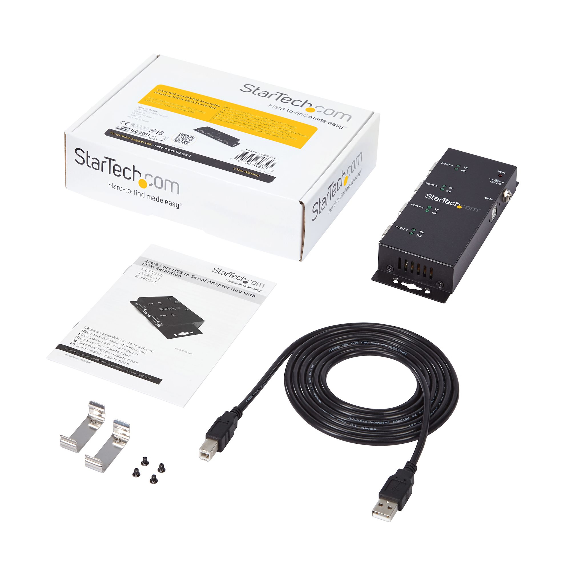Una caja con la marca StarTech.com y un concentrador negro con cables y accesorios.