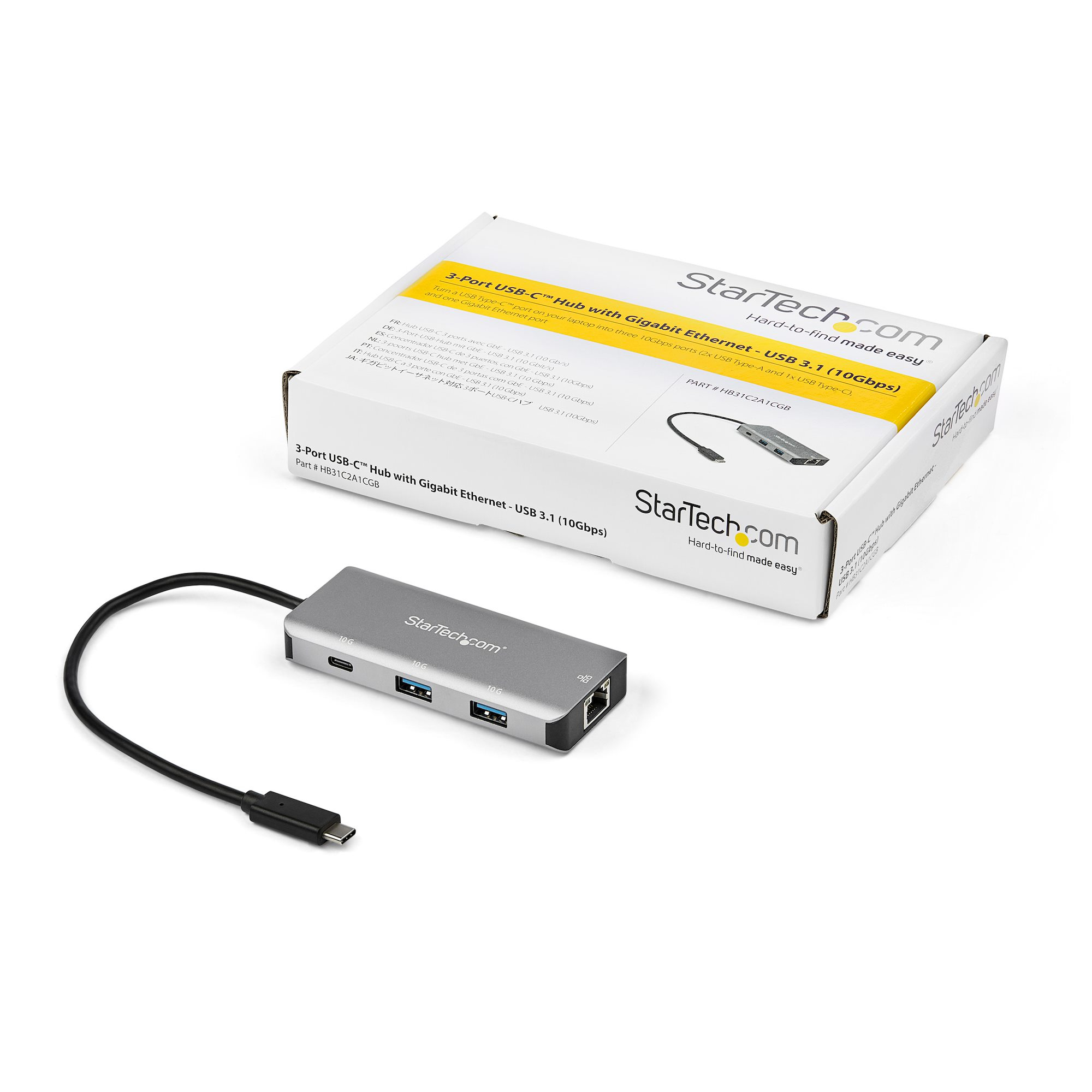 Silberner USB-Hub mit Anschlüssen und schwarzem Kabel, und eine weiße Box mit Text.