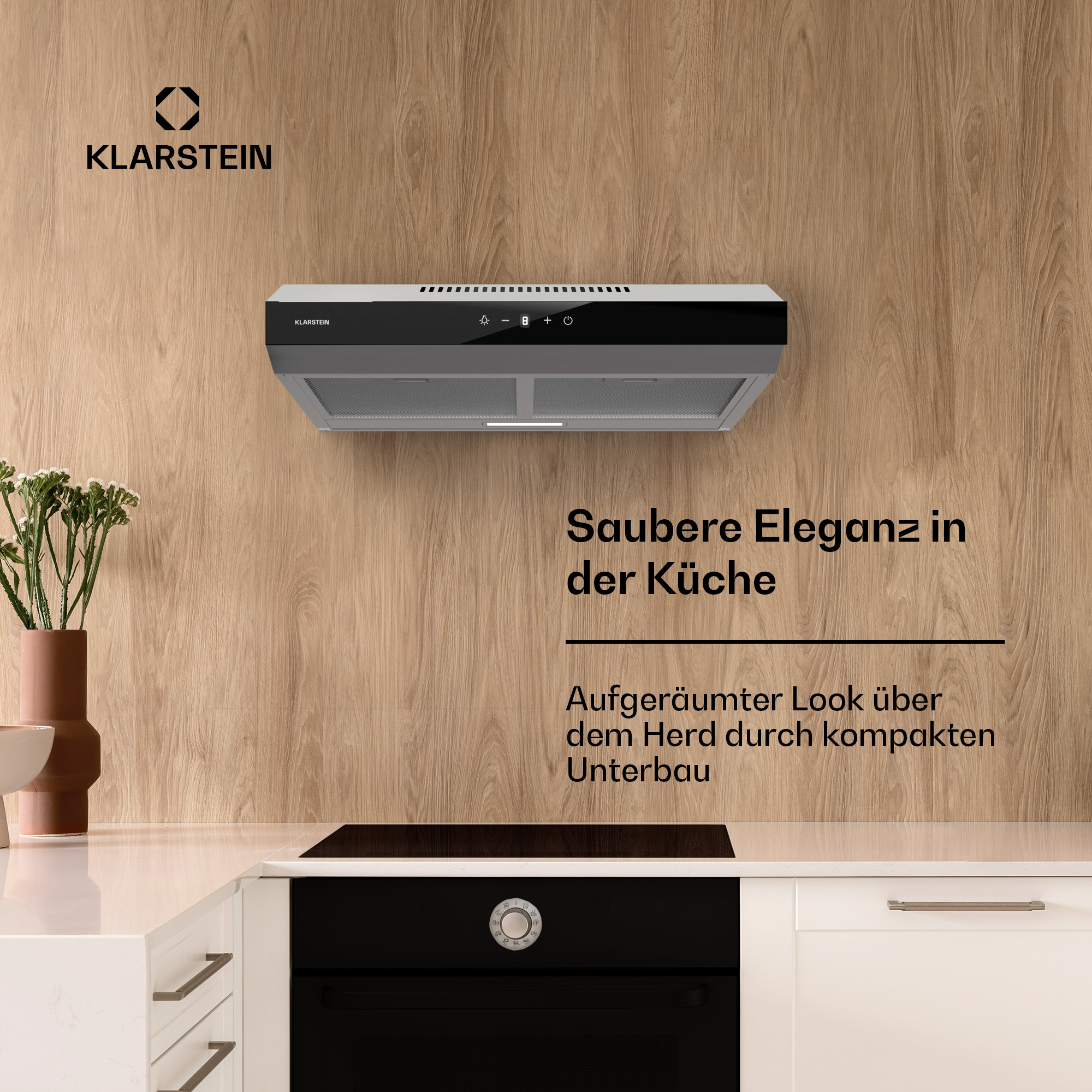 Una cappa a parete sopra un forno nero, con il testo "Saubere Eleganz in der Küche".