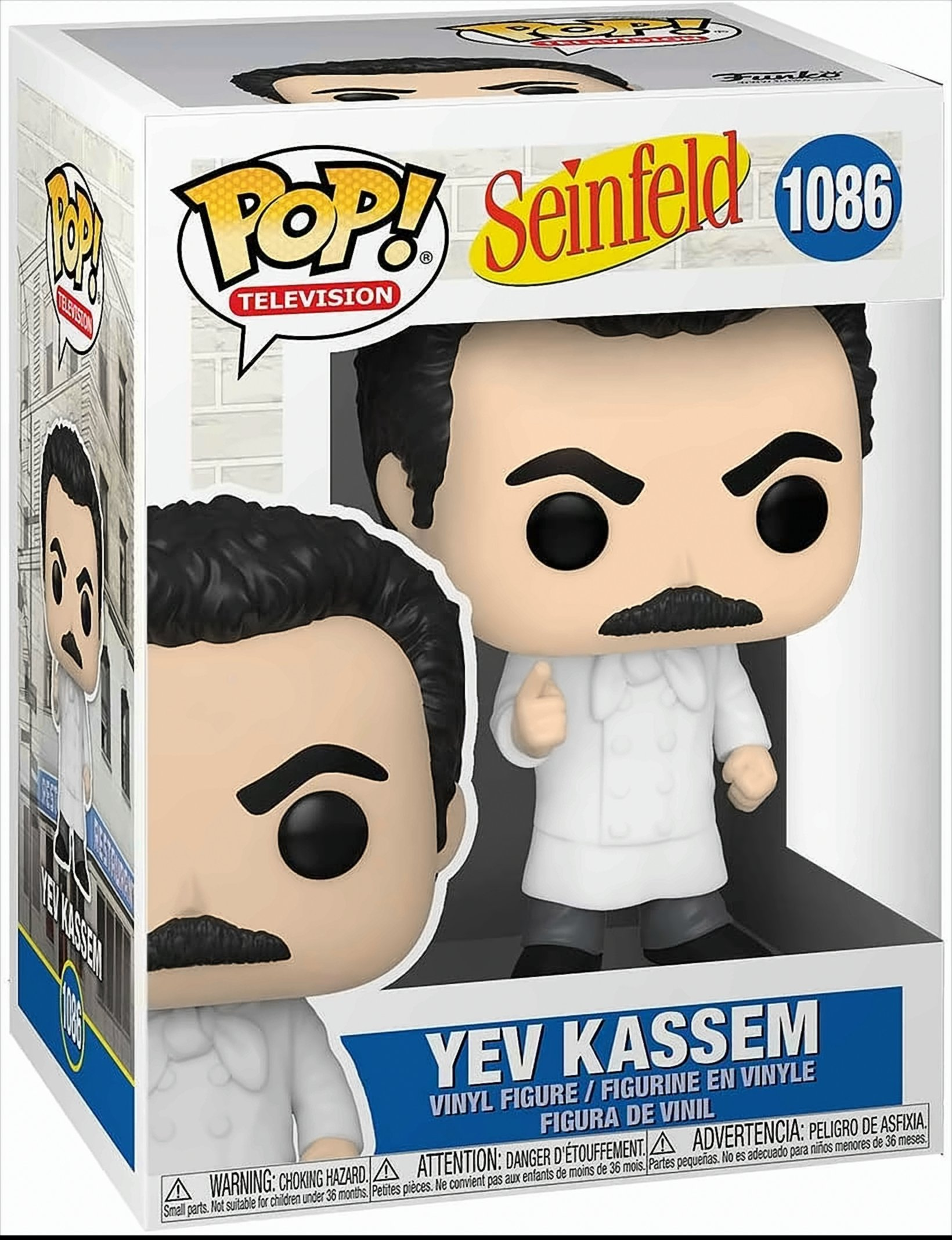 Yev Kassem Funko Pop Figur in der Box. Er trägt einen weißen Mantel und zeigt mit dem Finger. Hintergrund ist eine Ziegelmauer.