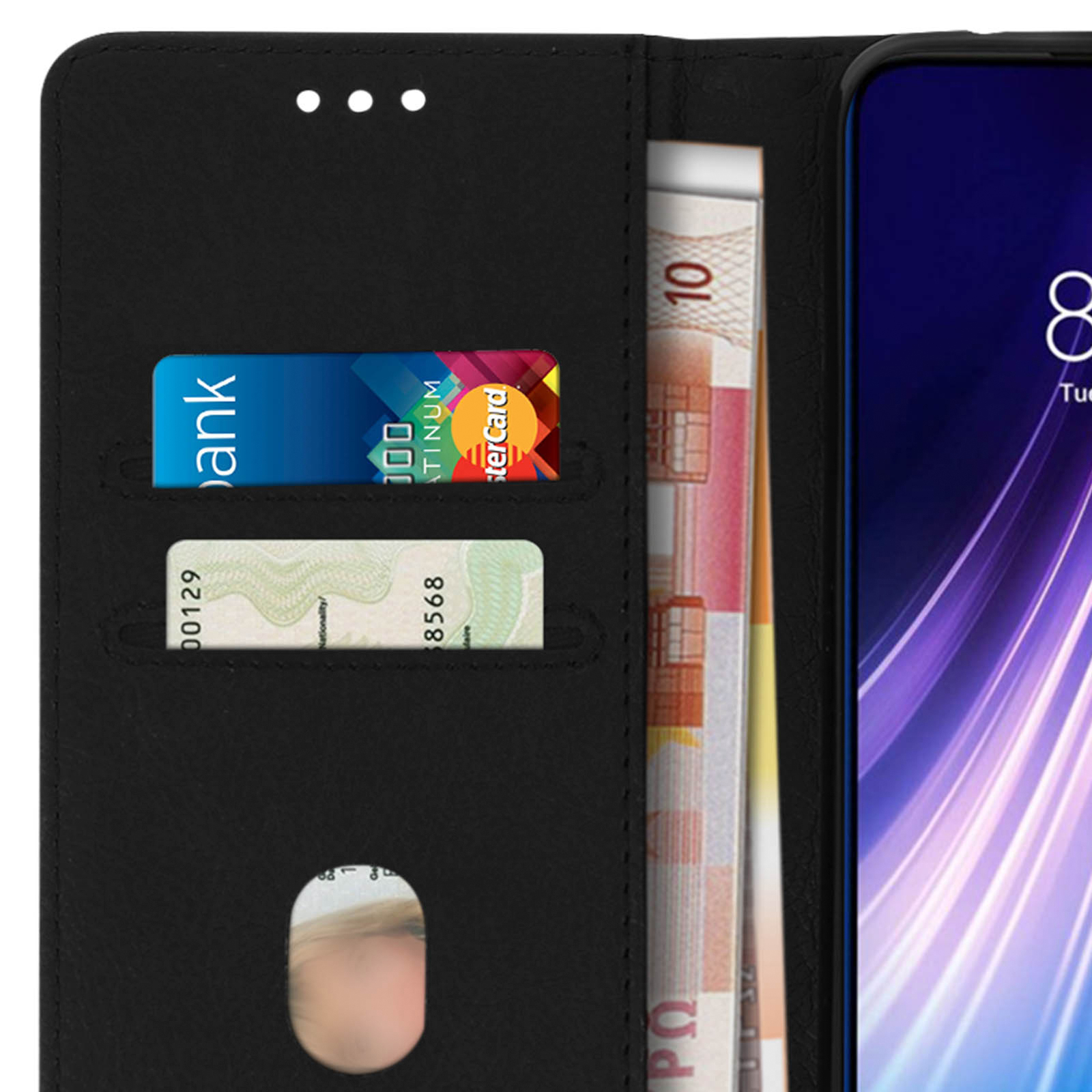 Un portefeuille ouvert montrant une carte, de l'argent liquide et un écran de téléphone.