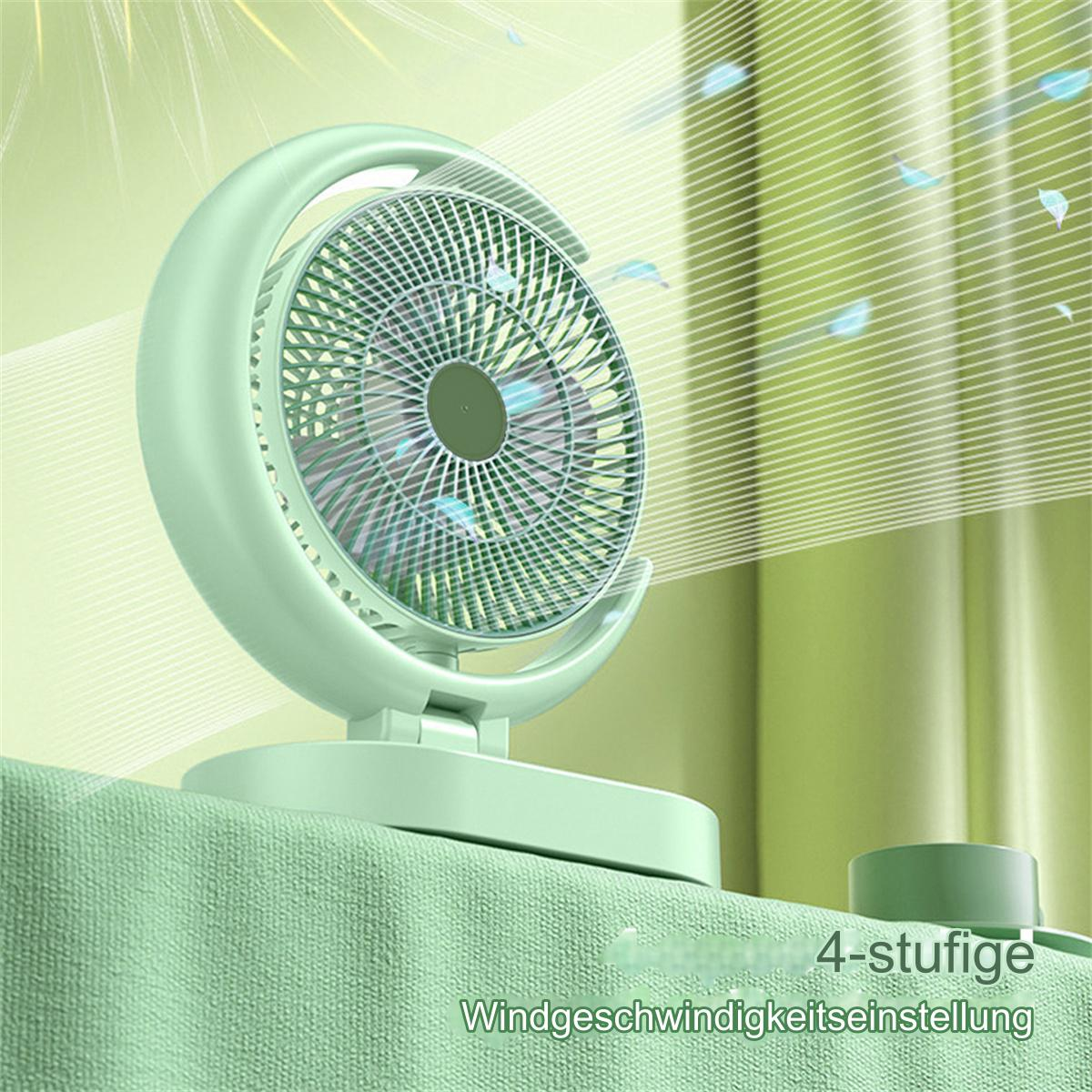 Ein mintgrüner Ventilator mit halbmondförmiger Halterung. Die Flügel befinden sich im Rahmen. Der Hintergrund ist eine grüne Wand.