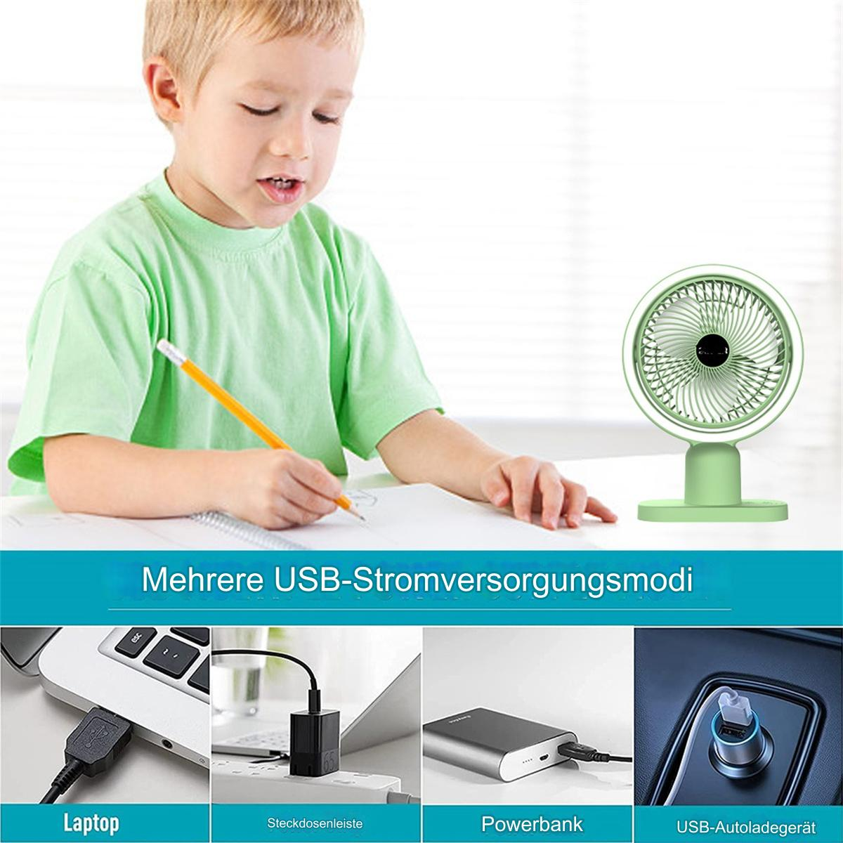 Ein Junge zeichnet. Ein grüner Ventilator auf einem Tisch mit USB-Optionen.