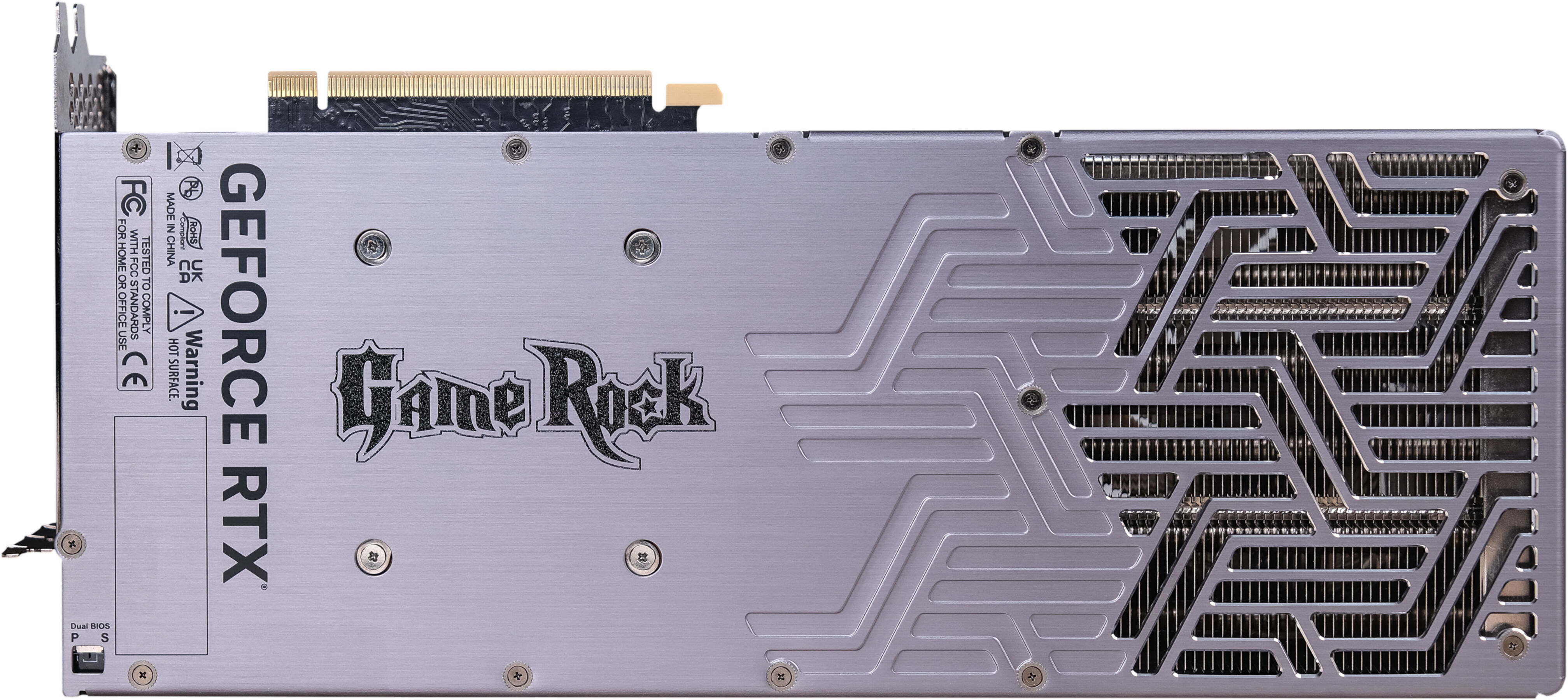 Scheda grafica argentata, vista posteriore, con testo 'GEFORCE RTX' e logo 'Game Rock'. Dissipatore di calore.