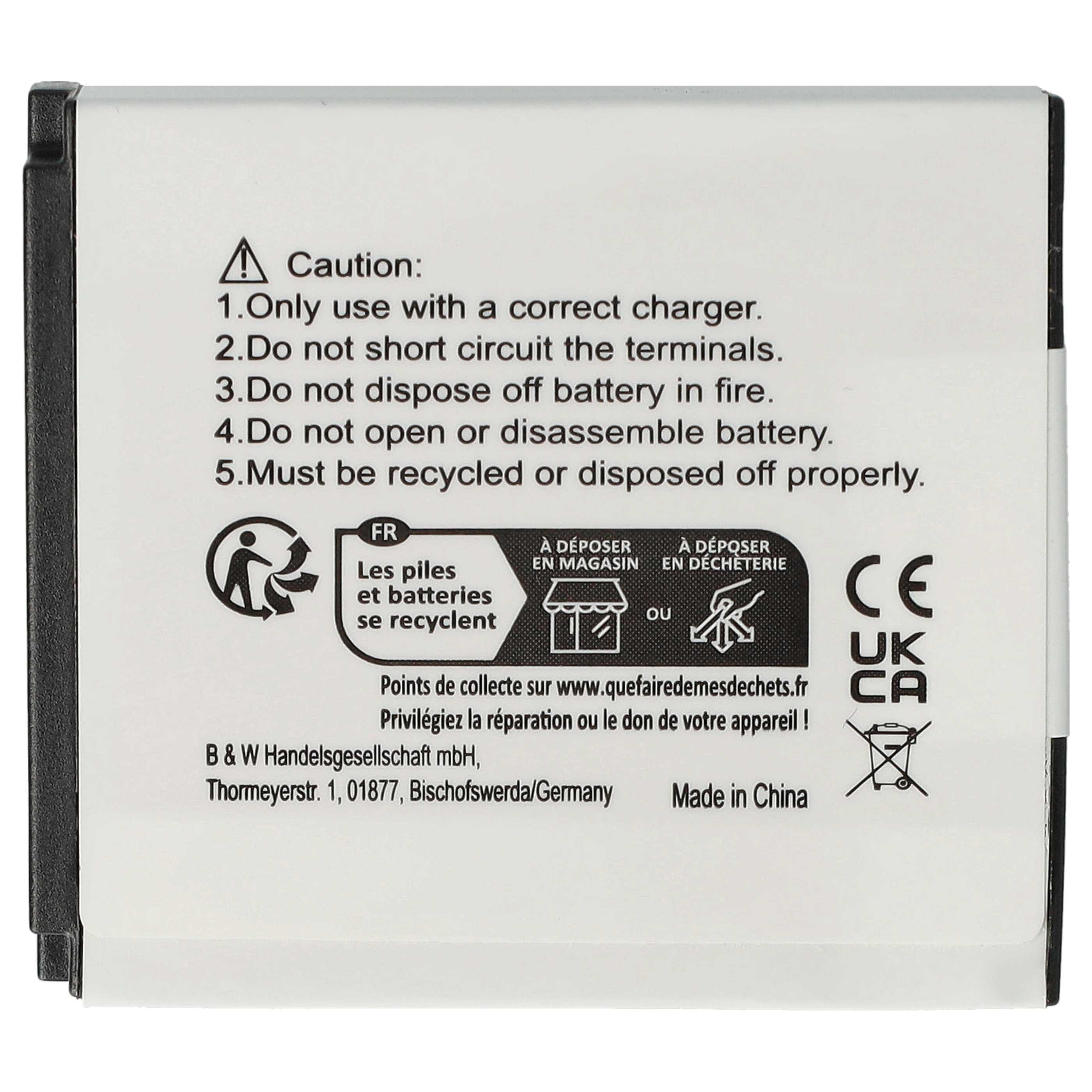 Batterie mit Warnhinweisen, Recycling-Symbolen und Text in Englisch und Französisch. Weißer Hintergrund.