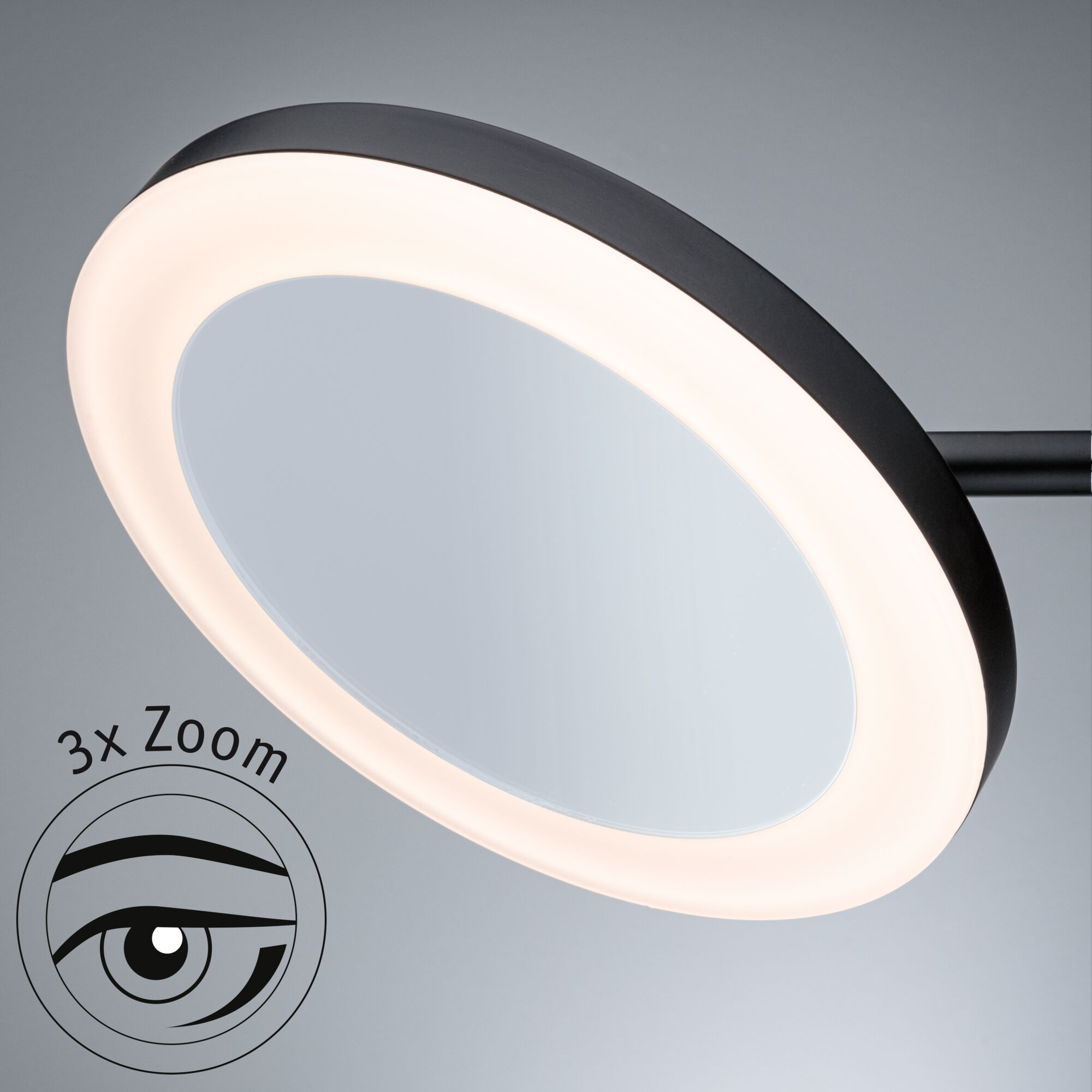 Schwarzer Schminkspiegel mit hellem Ringlicht. Ein 3x Zoom-Symbol befindet sich in der unteren linken Ecke.