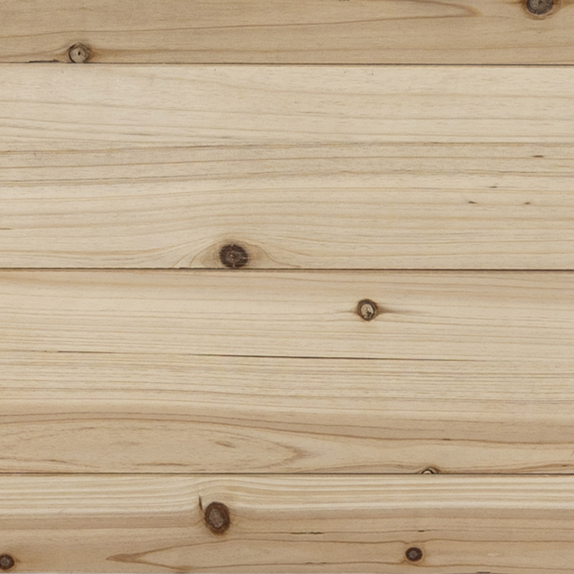 Primo piano di assi di legno di colore chiaro, che mostrano i dettagli delle venature del legno.