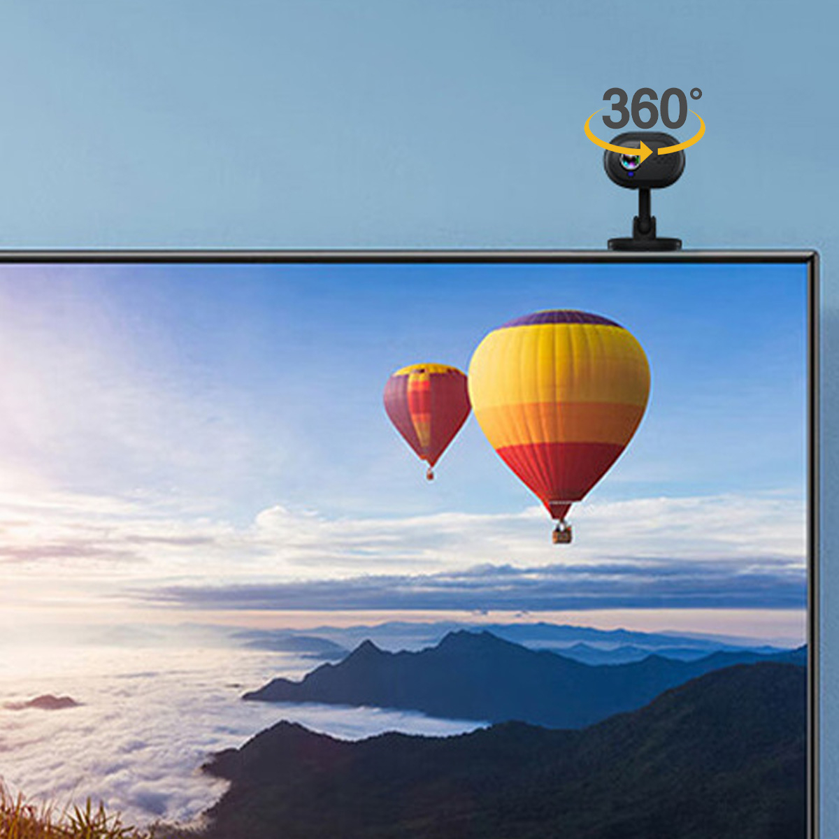 Ein Fernseher mit einer Kamera oben und zwei Heißluftballons im Hintergrund.