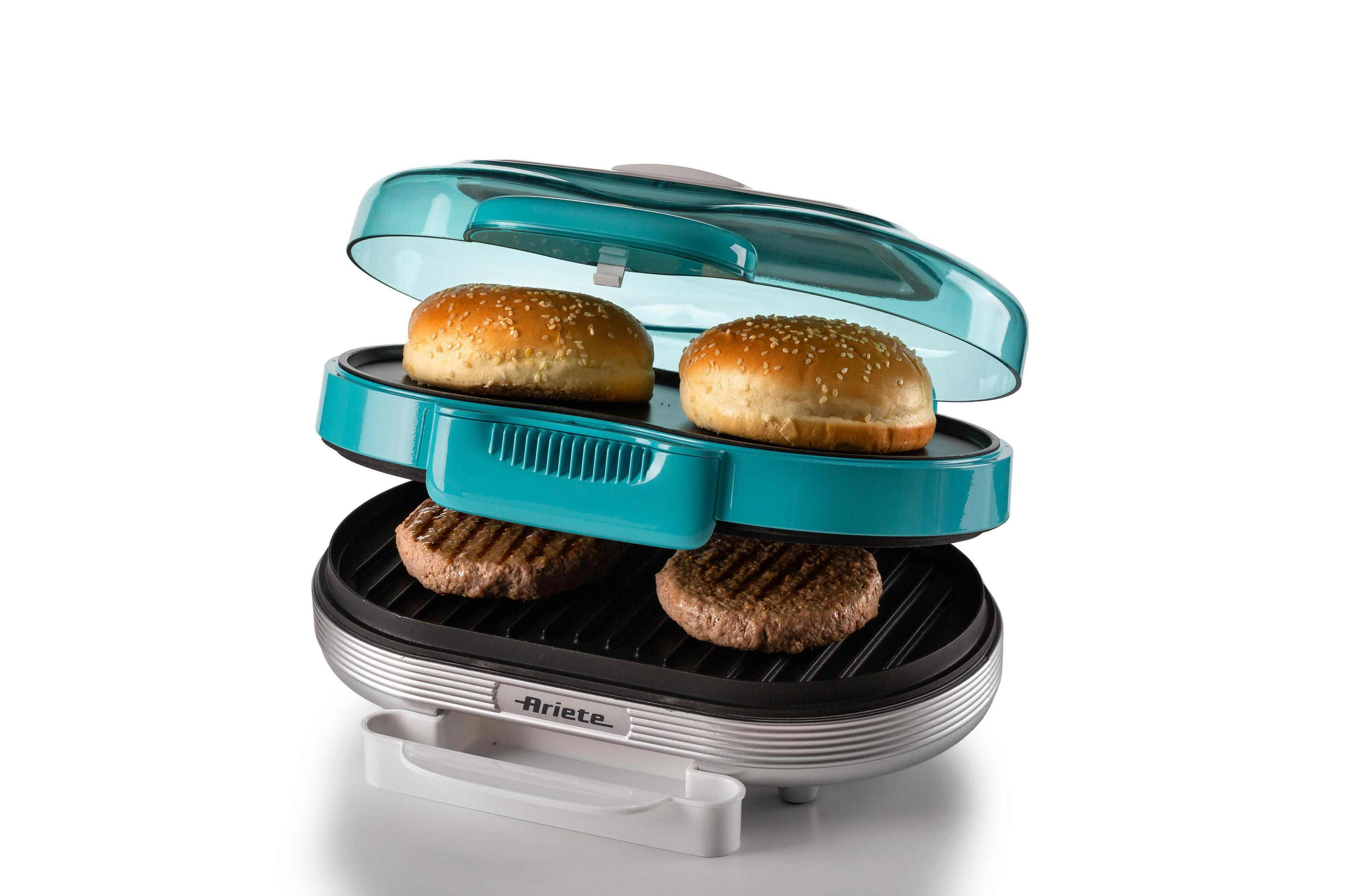 Een turkoois en zilveren burgergrill met twee burgers en broodjes erin.