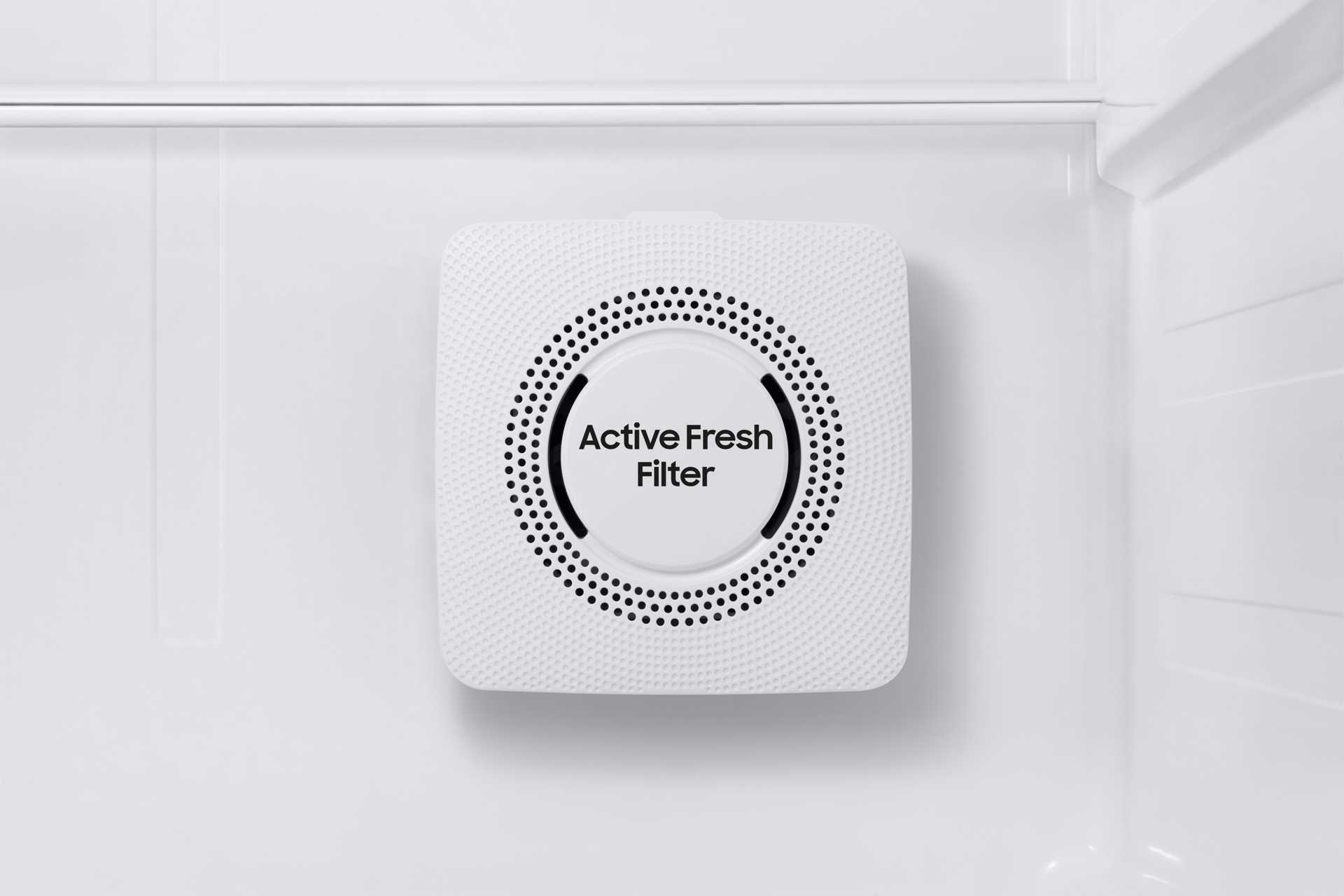 White Active Fresh Filter inside a refrigerator. The filter is square and has holes.