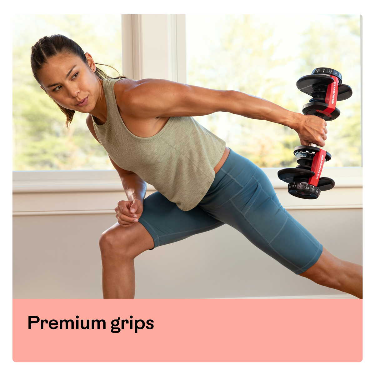 Woman exercising with a dumbbell. Text says "Premium grips".