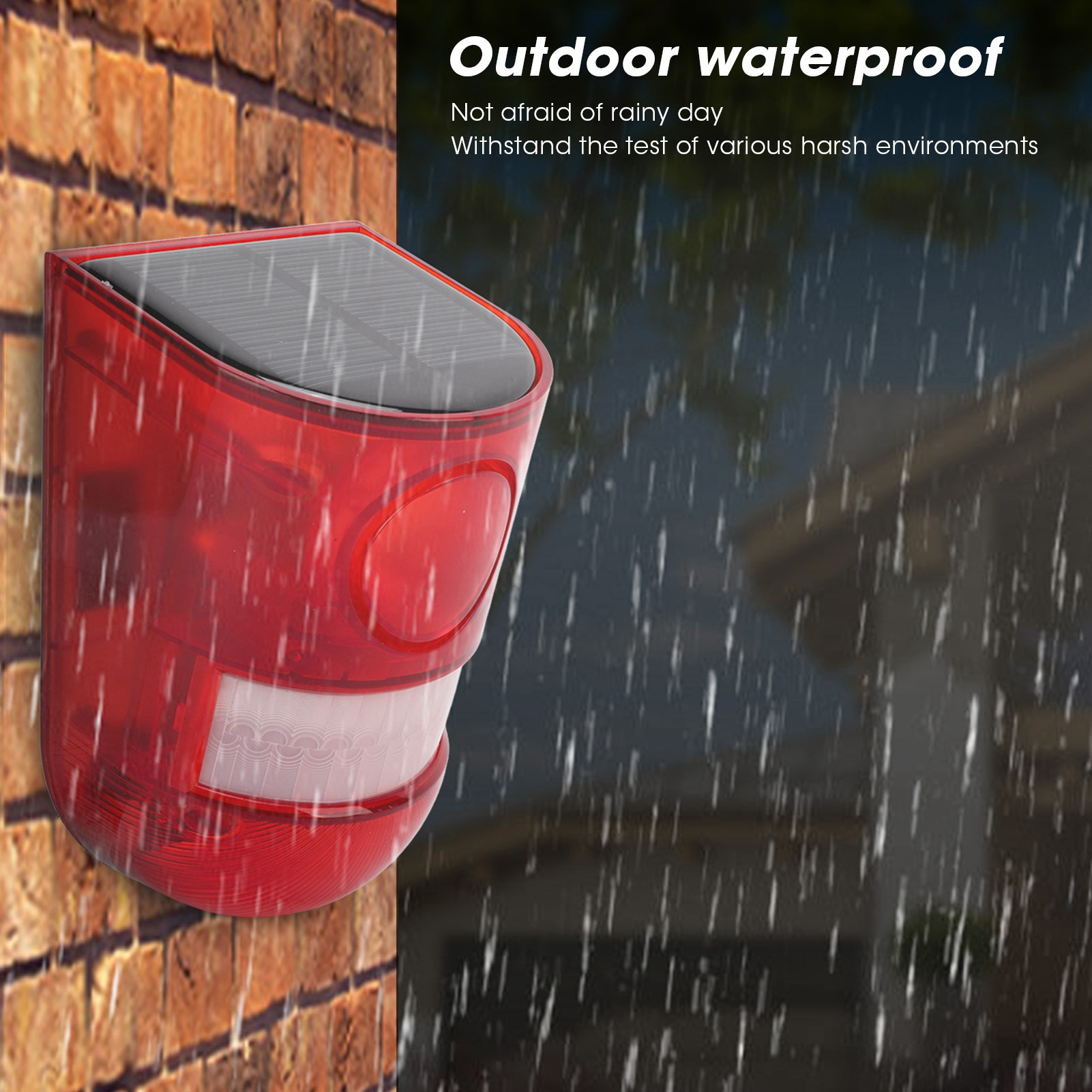 Ein roter, wasserdichter Außenalarm an einer Ziegelmauer, mit Regentropfen.