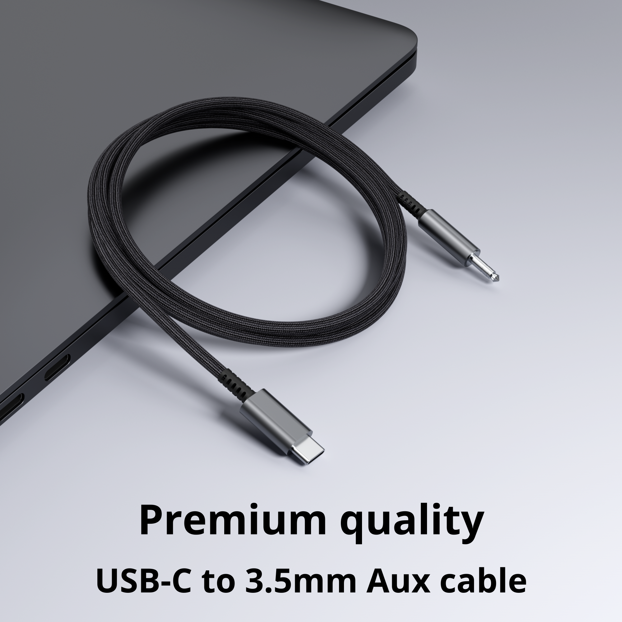 Black USB-C to 3.5mm aux cable coiled on a gray surface. Text: Premium quality USB-C to 3.5mm Aux cable.