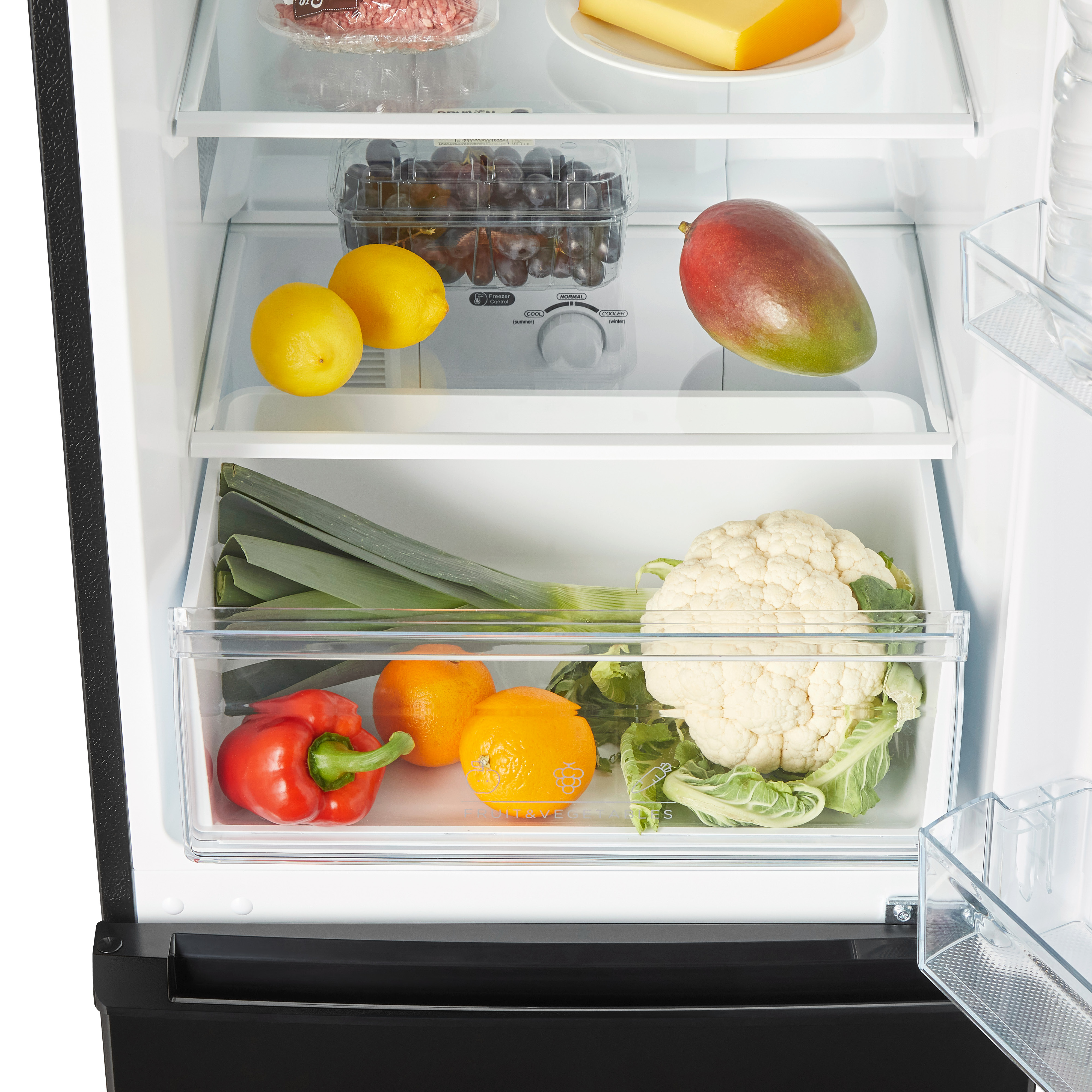 Open refrigerator filled with fruits, vegetables, and other food items.