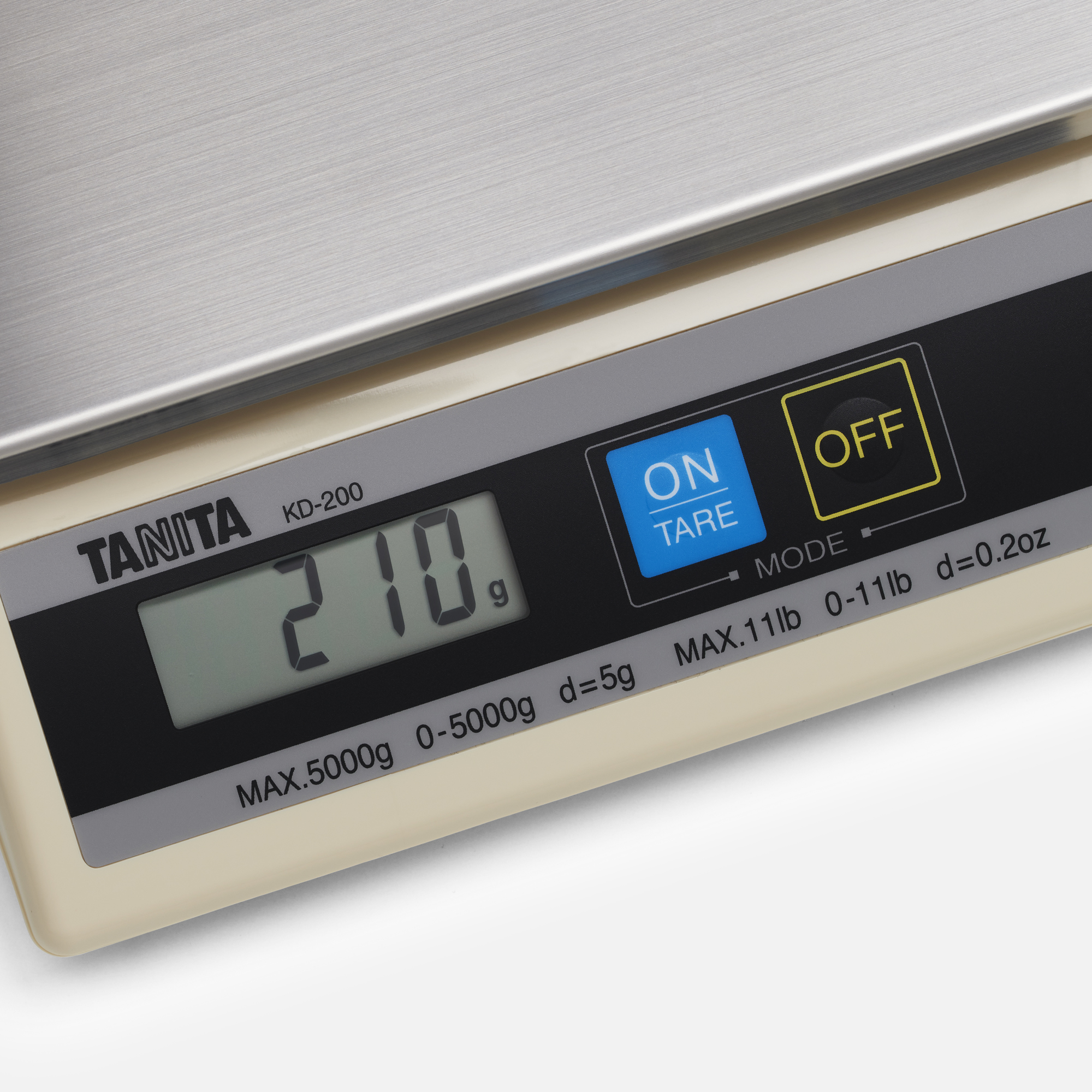 A digital scale displaying 210g with buttons for 'ON' and 'OFF'.