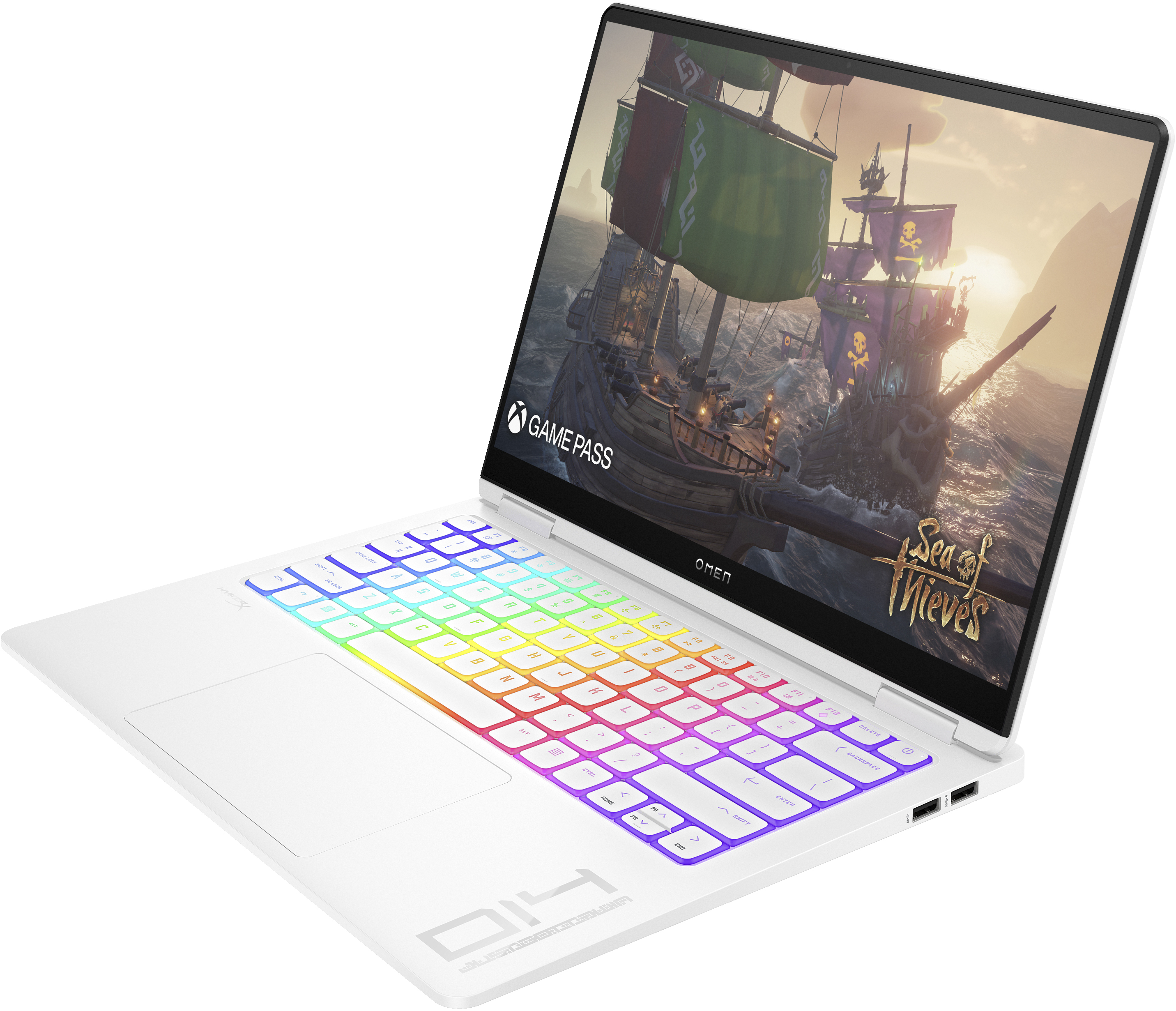 Ordinateur portable blanc avec écran ouvert affichant un jeu de bateau pirate. Le clavier a des touches colorées et éclairées.