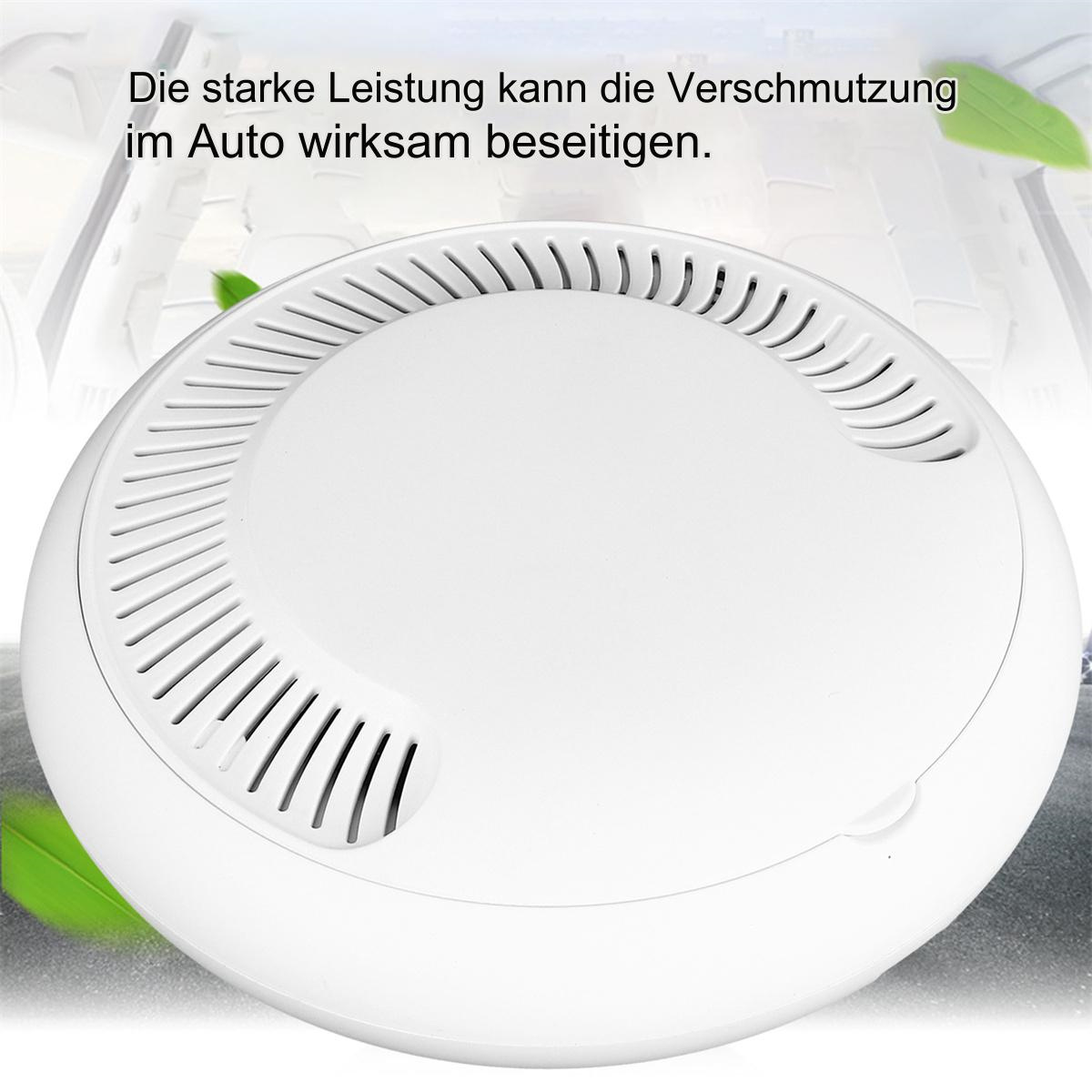 Weißer Luftreiniger. Er hat eine runde Form mit Lüftungsschlitzen. Text auf Deutsch ist sichtbar.