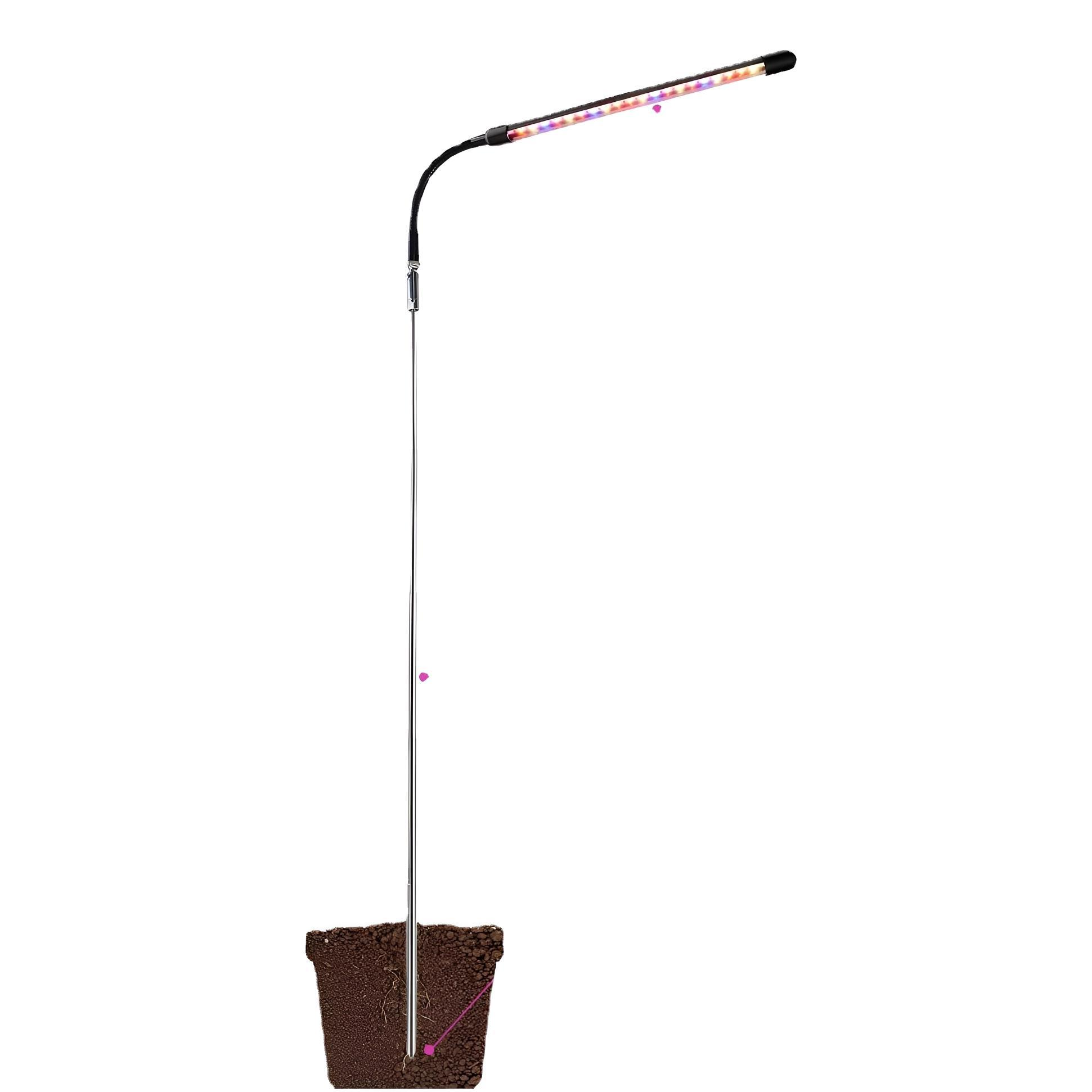 Pflanzenwachstumslicht. Metallstange mit einem Lichtkopf über einem braunen Topf.