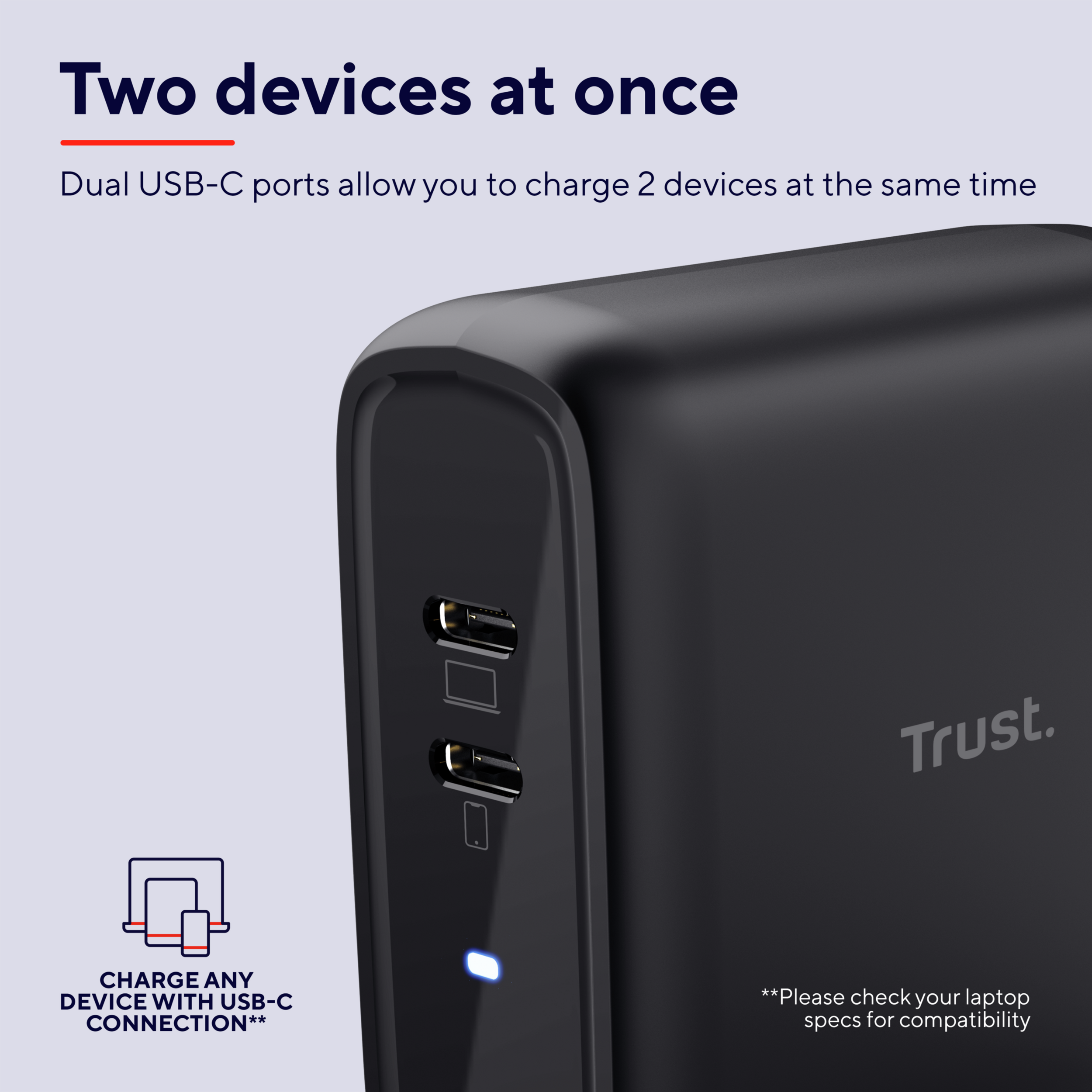Zwarte Trust oplader met dubbele USB-C poorten, tekst over twee apparaten.