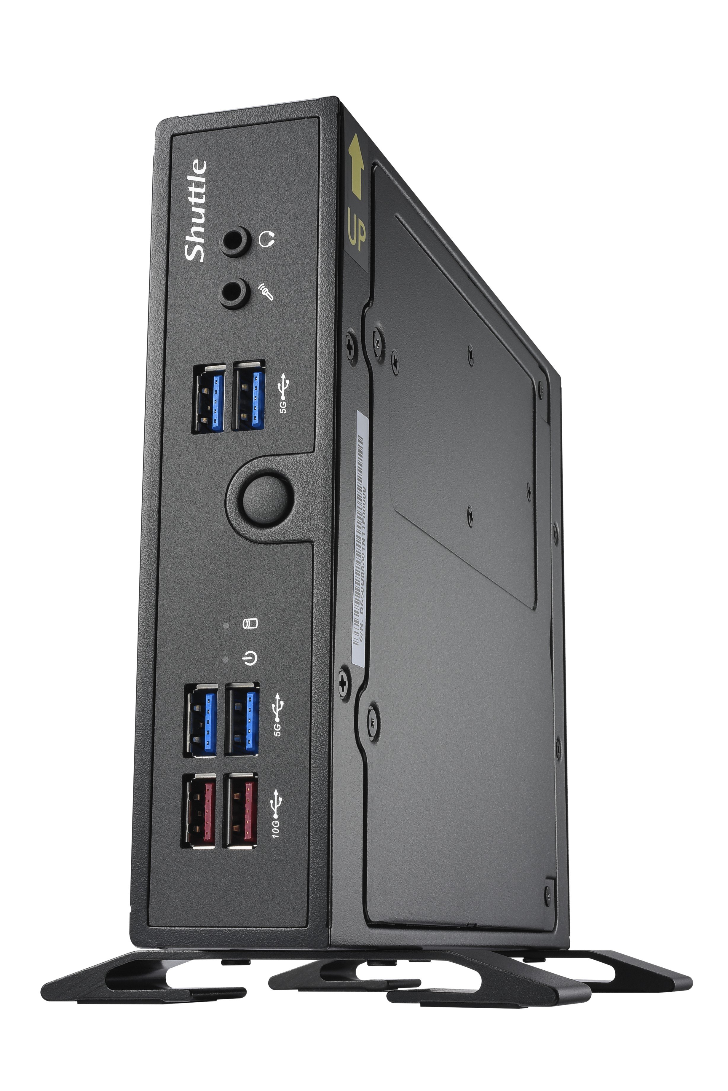 Un PC Shuttle nero con porte USB, jack audio e un pulsante di accensione, su un supporto.