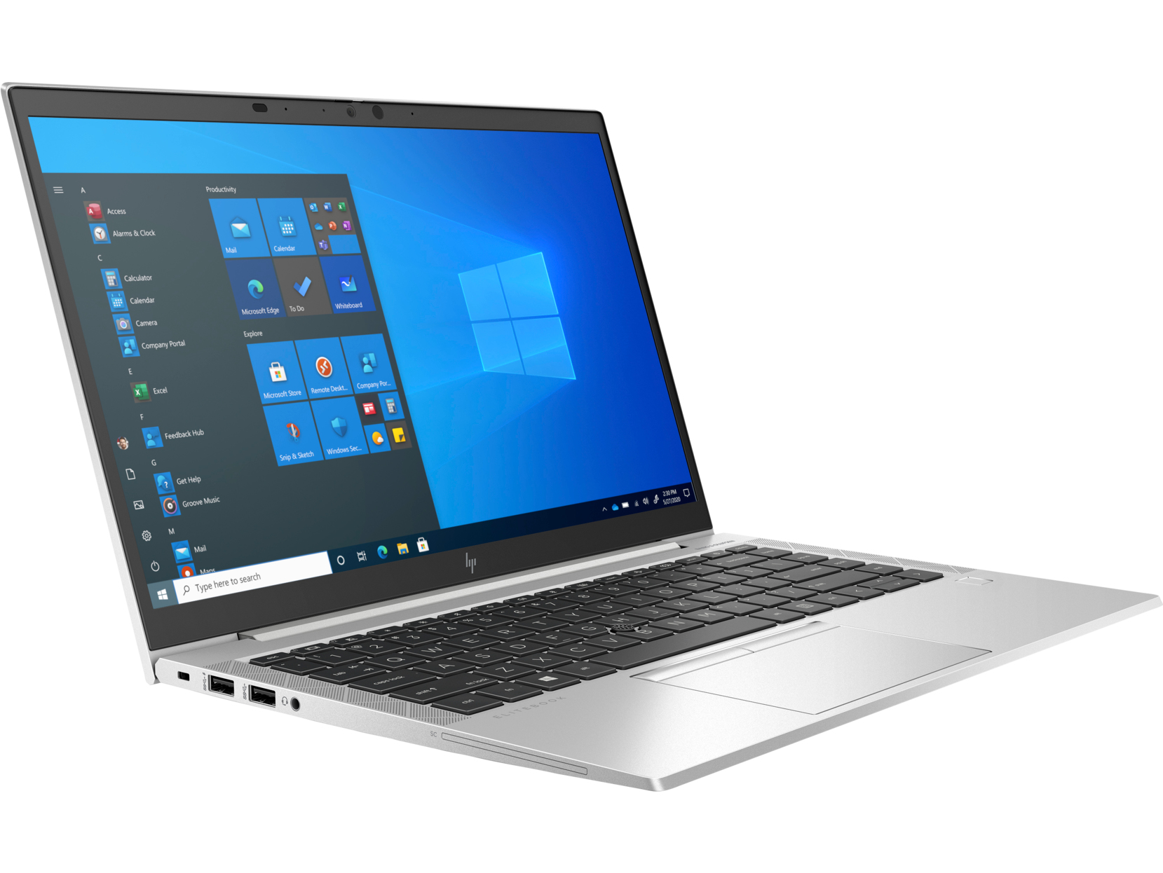 Ordinateur portable argenté ouvert affichant le bureau Windows. Le clavier est visible.