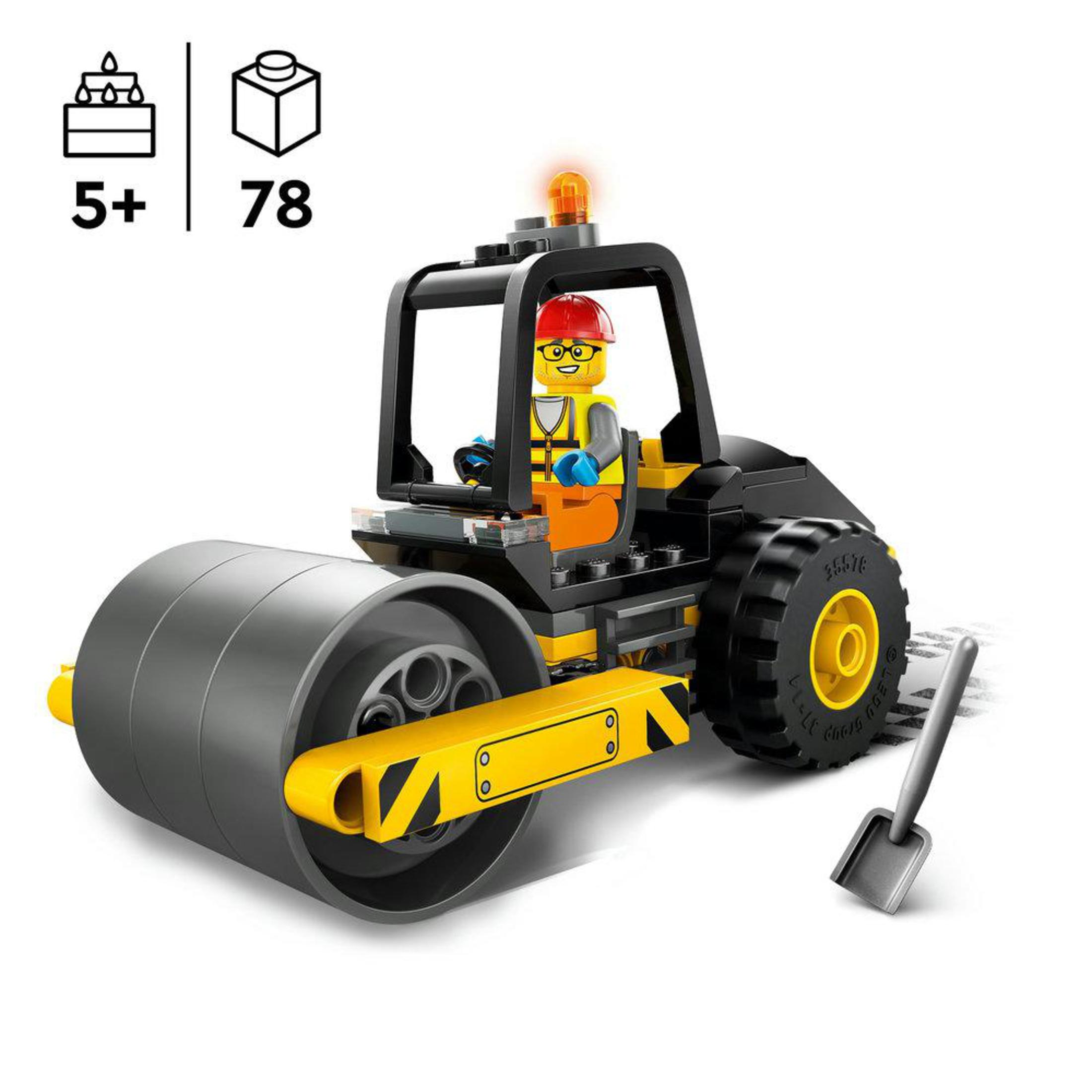 Lego-wals met een figuur en een schop, op een witte achtergrond.