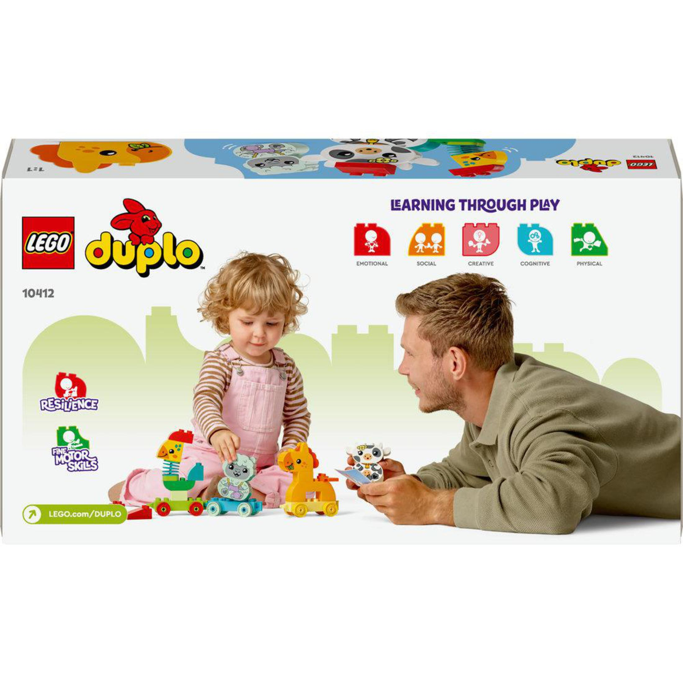 Pudełko Lego Duplo z dzieckiem i dorosłym bawiącym się zabawkami.