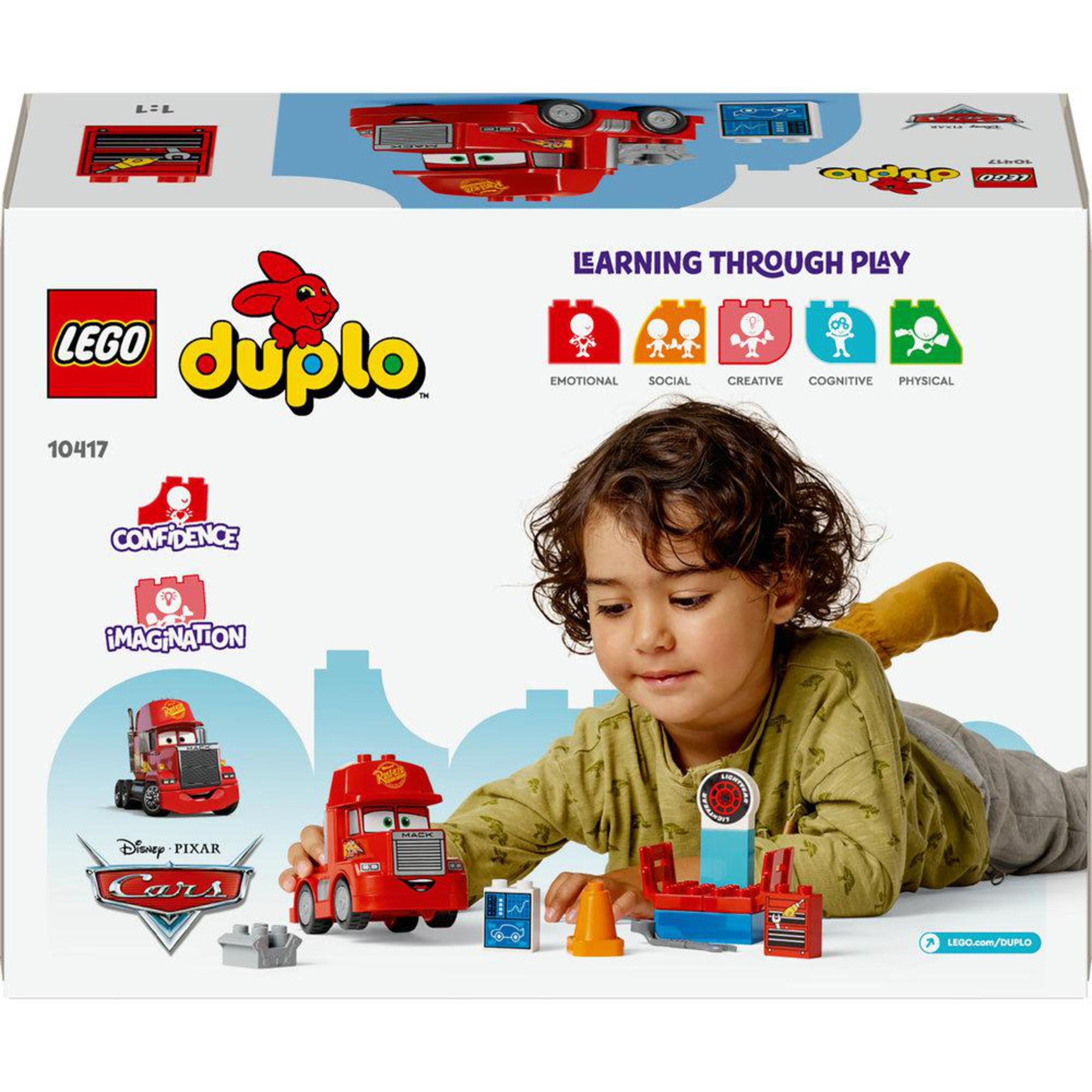 Duplo Lego doos met een spelend kind. De doos toont een rode vrachtwagen. Educatieve pictogrammen worden getoond.
