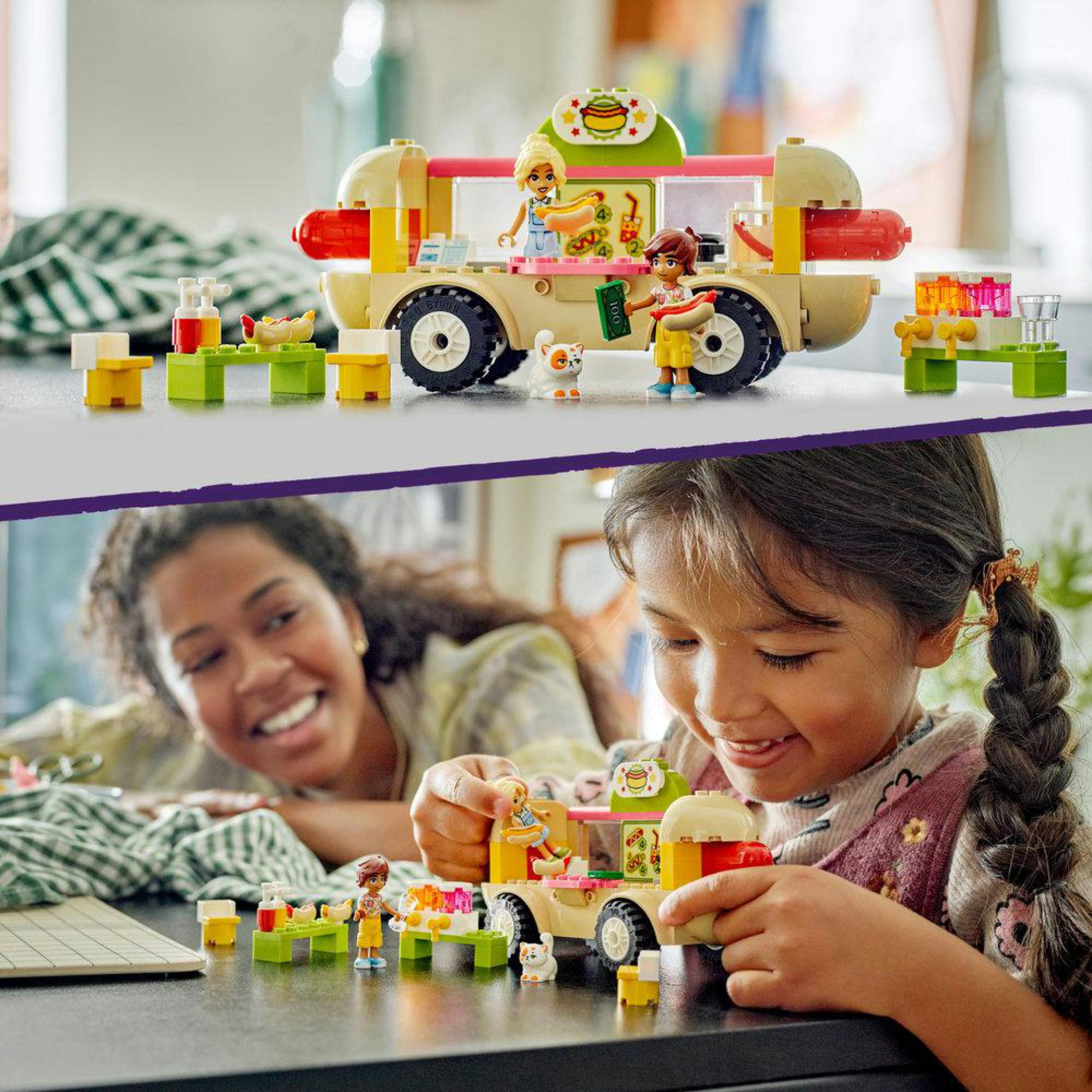 Set de camión de comida Lego Friends. Camión de comida con minifiguras y un niño jugando con el set.