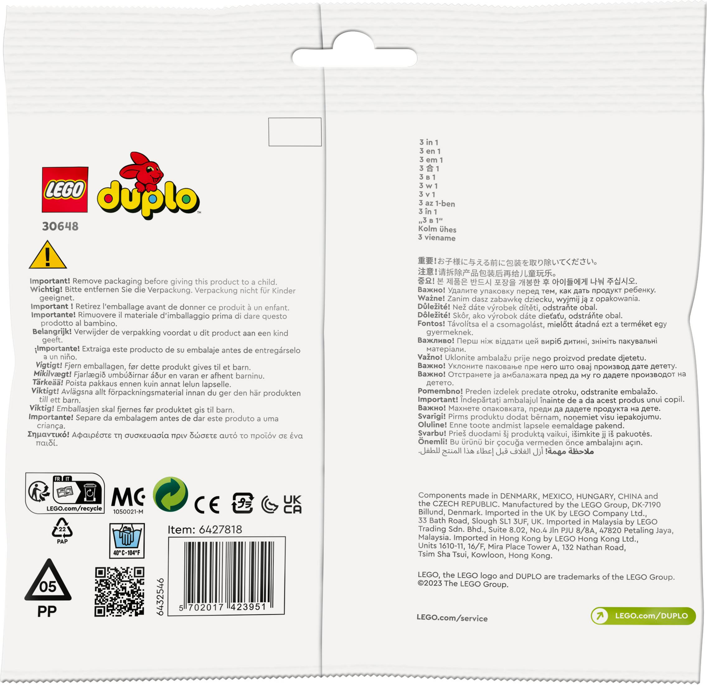 Een Lego Duplo verpakking met tekst en afbeeldingen. Het is een witte en rode verpakking.