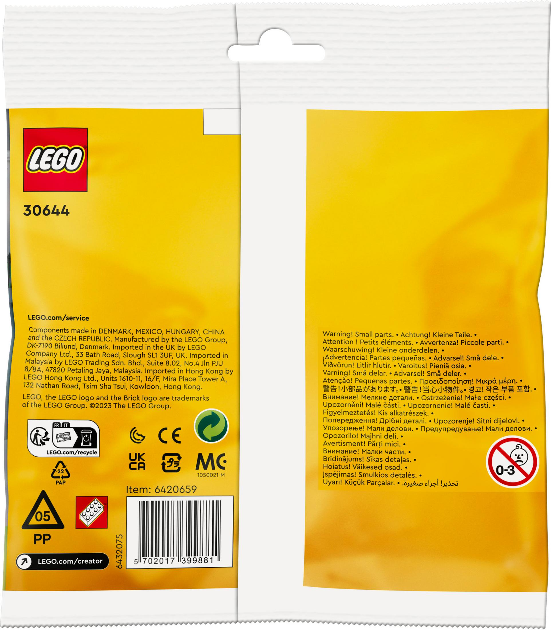 Çok dilli metin içeren sarı LEGO ambalajı, küçük parçalarla ilgili uyarı dahil.