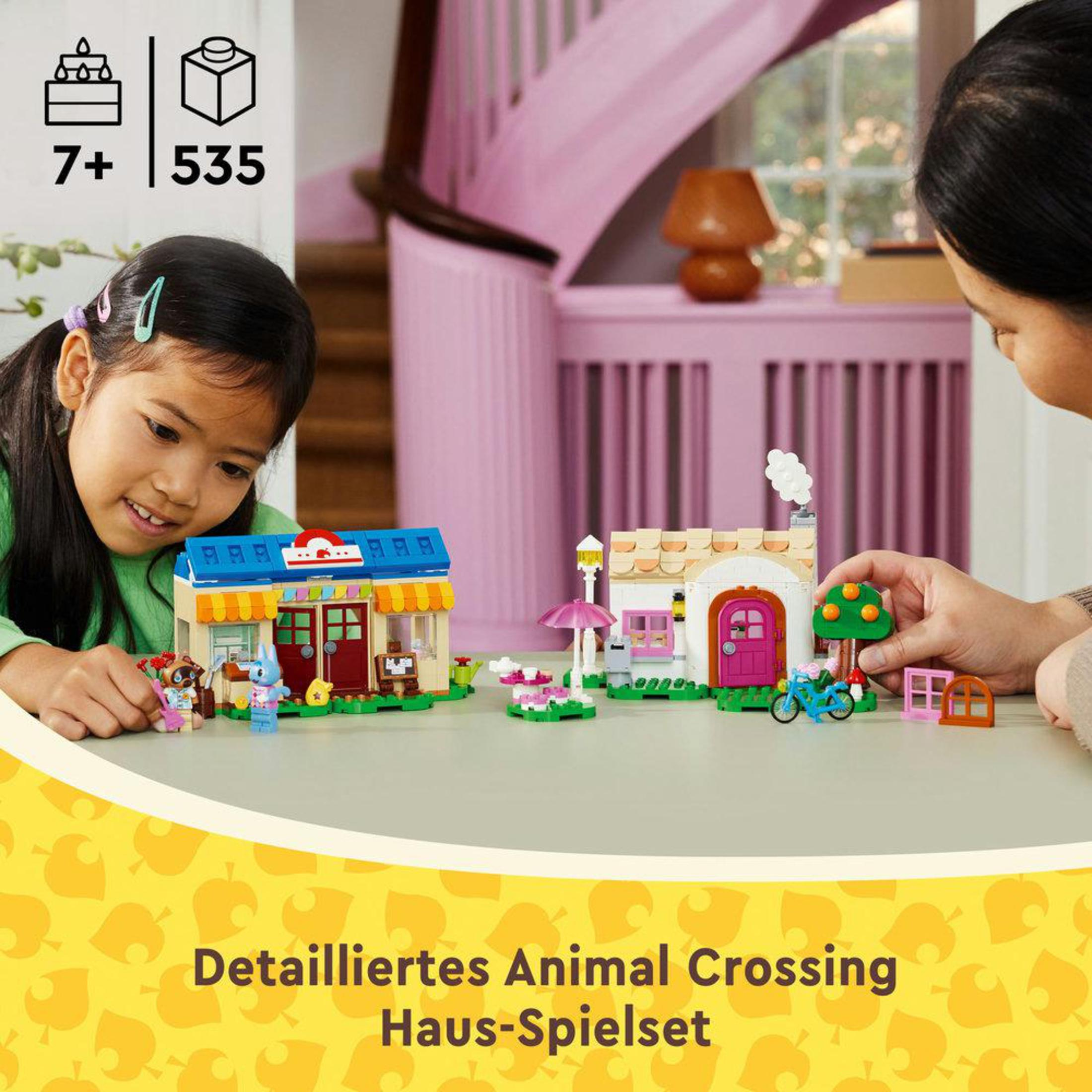 Twee meisjes spelen met een Lego-set van huizen. De set is een gedetailleerde Animal Crossing Haus-Spielset.
