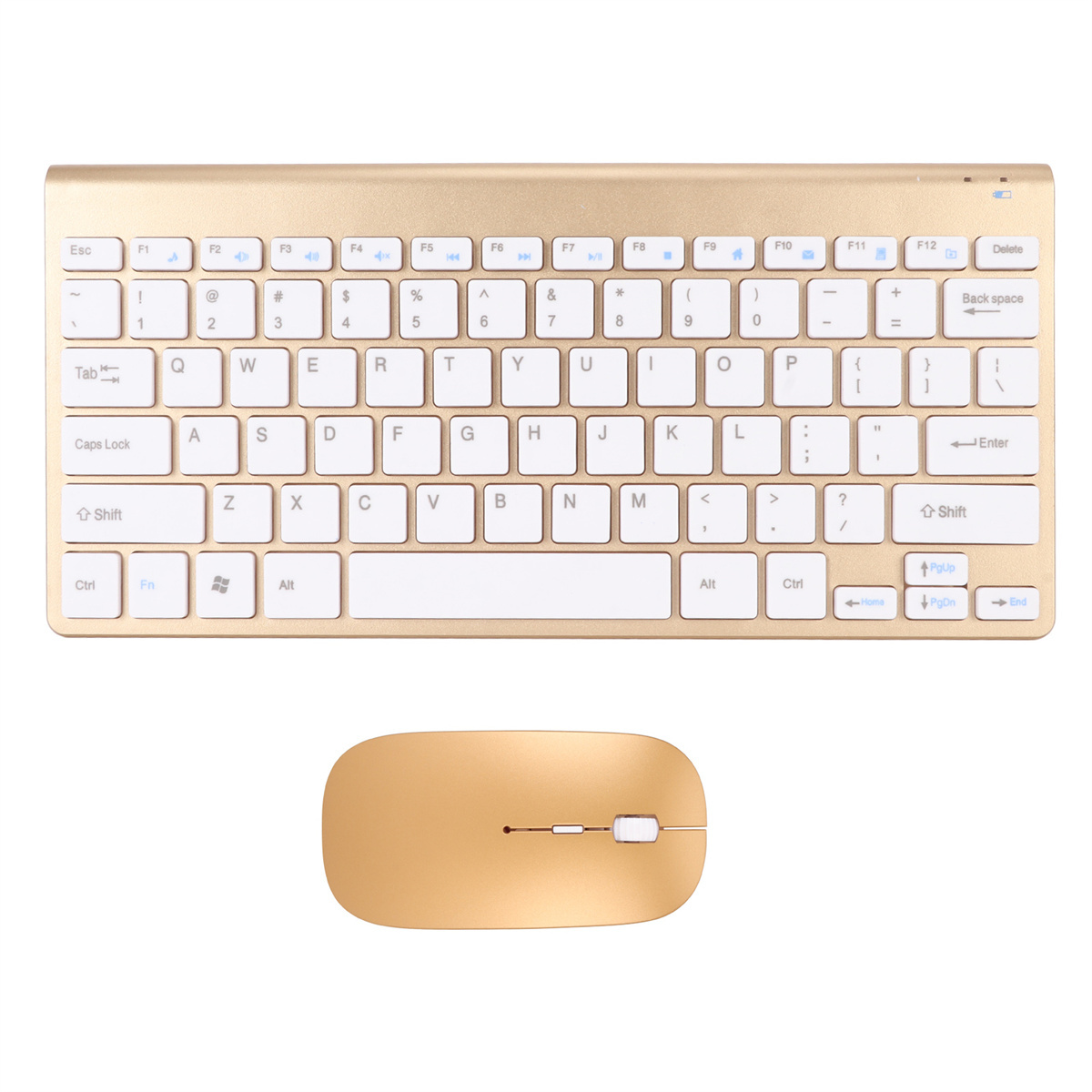 Eine goldfarbene Tastatur- und Maus-Kombination. Weiße Tasten auf der Tastatur, isoliert.