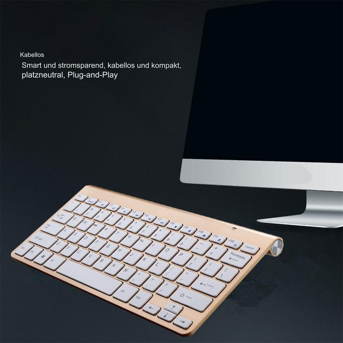 Goldfarbene kabellose Tastatur auf einem Schreibtisch, schwarzer Hintergrund, modernes Design.