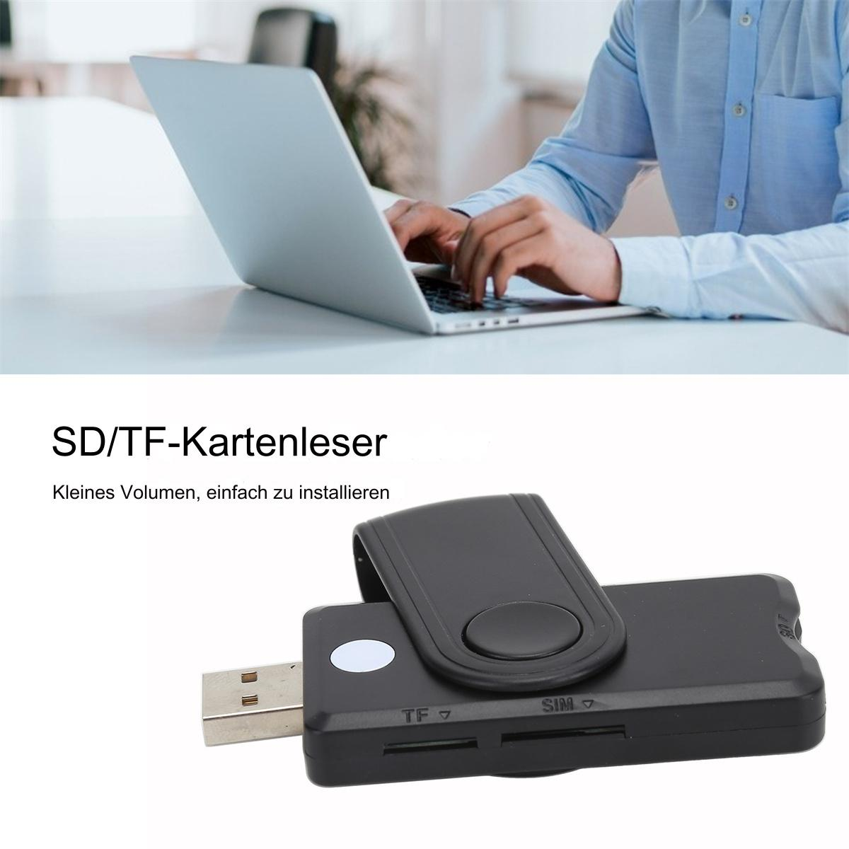 Ein schwarzer USB-Kartenleser und eine Person, die im Hintergrund an einem Laptop arbeitet.