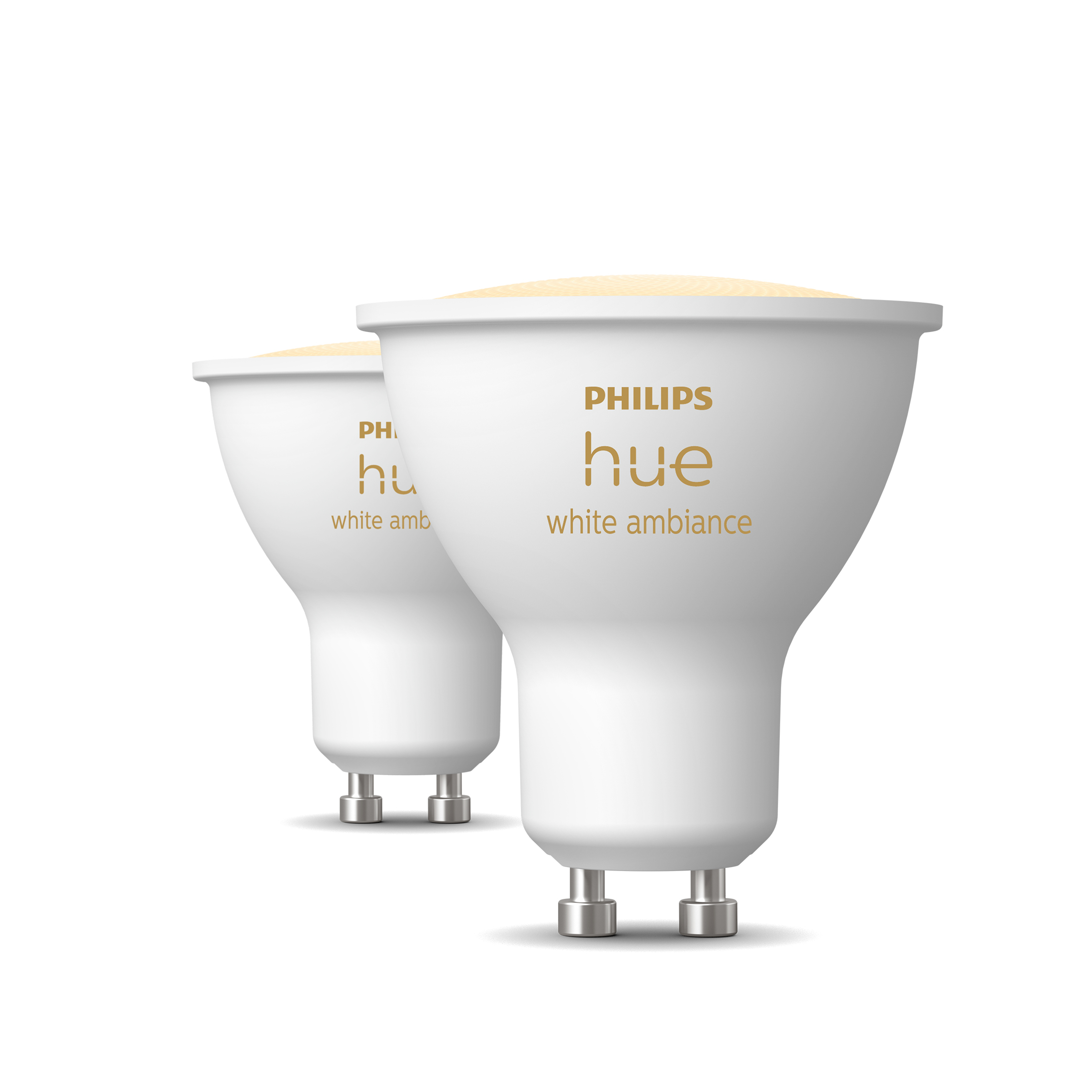 Dwa białe reflektory Philips Hue obok siebie na białym tle.