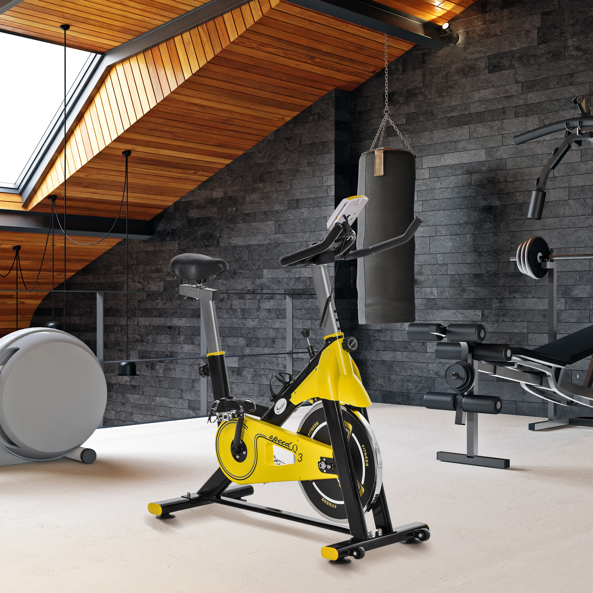 Una bicicleta estática amarilla en un gimnasio en casa con equipo.