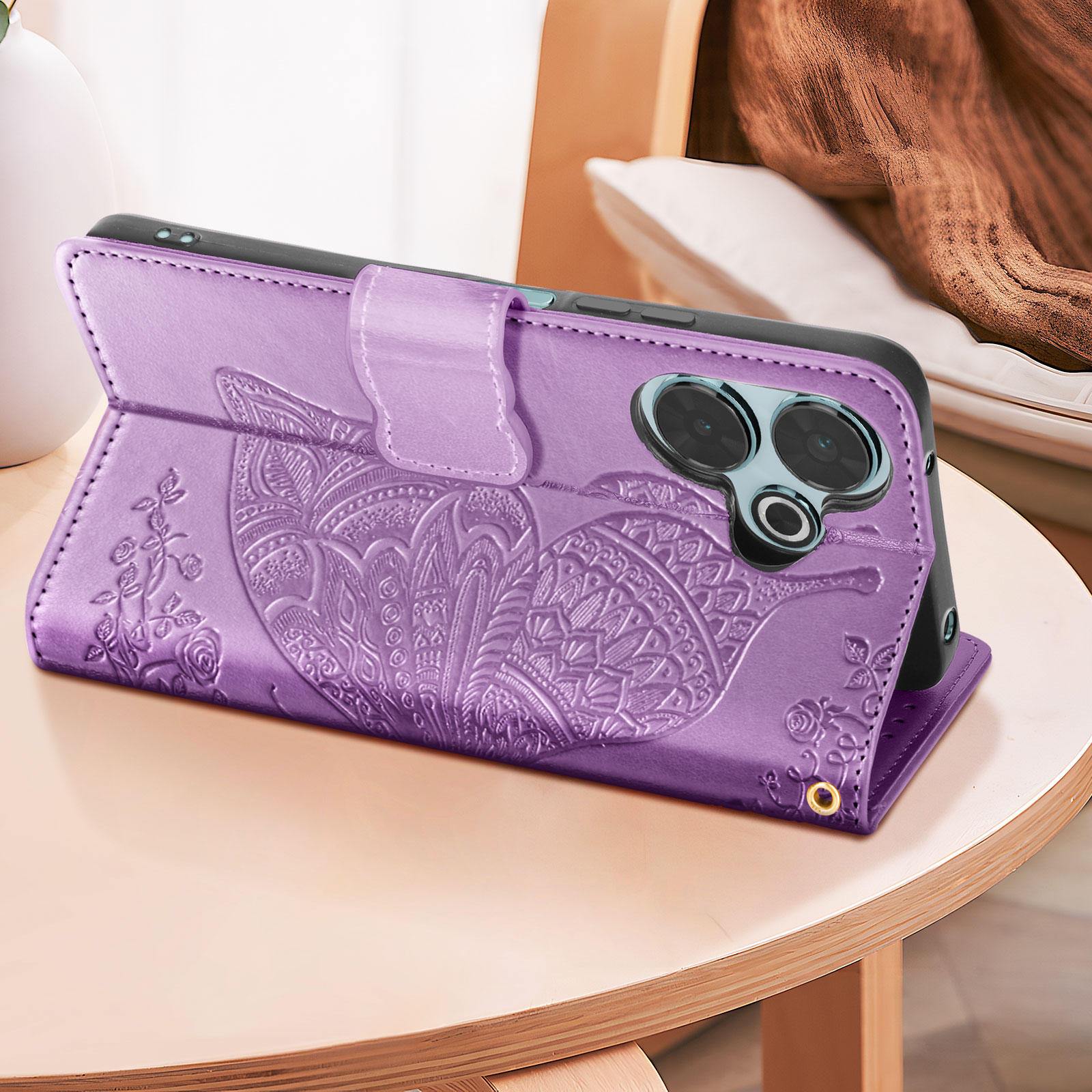 Custodia per telefono viola con design in rilievo, aperta. Un telefono è visibile con la fotocamera.