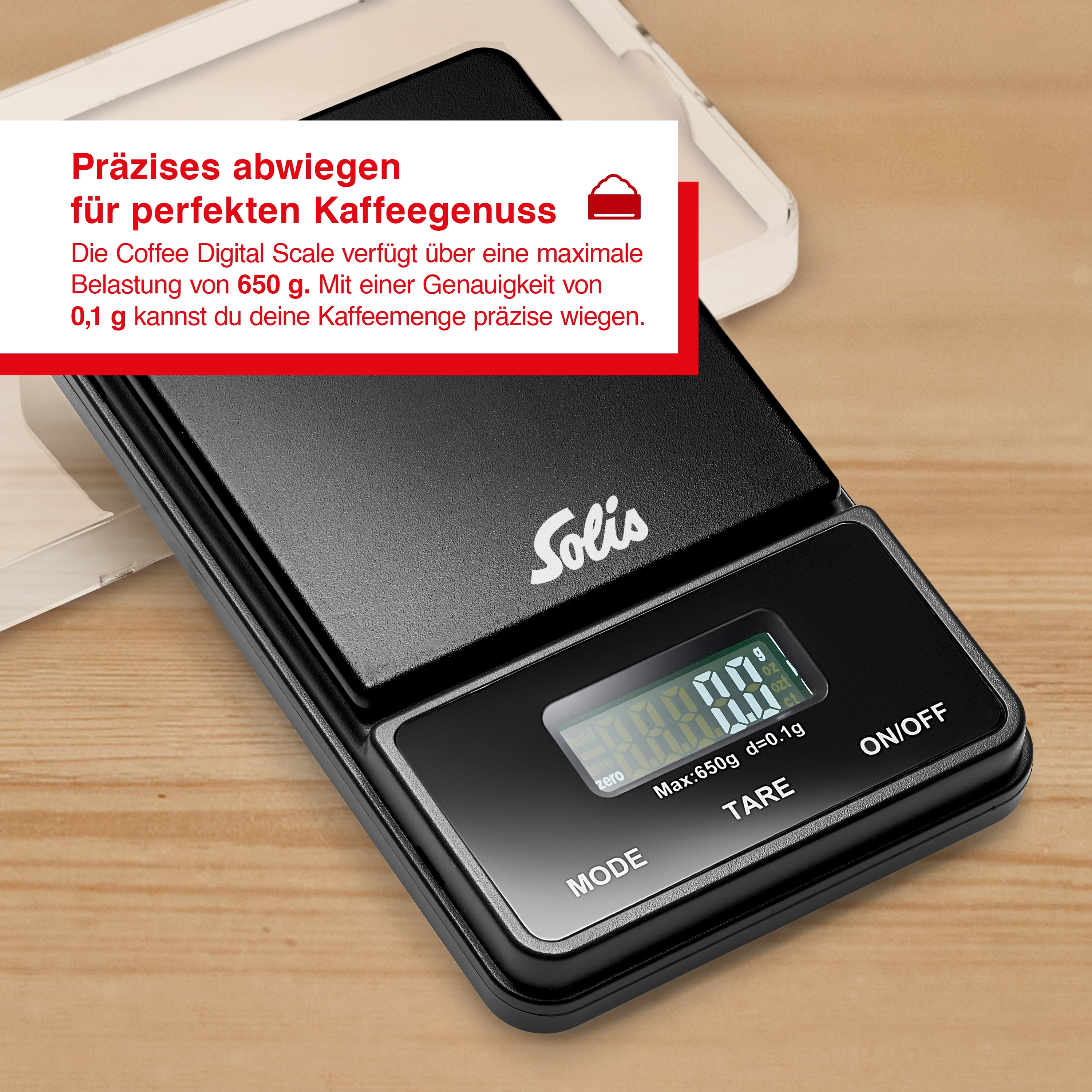 Eine schwarze digitale Kaffeewaage mit einem Bildschirm, der Zahlen anzeigt, auf einer Holzoberfläche.