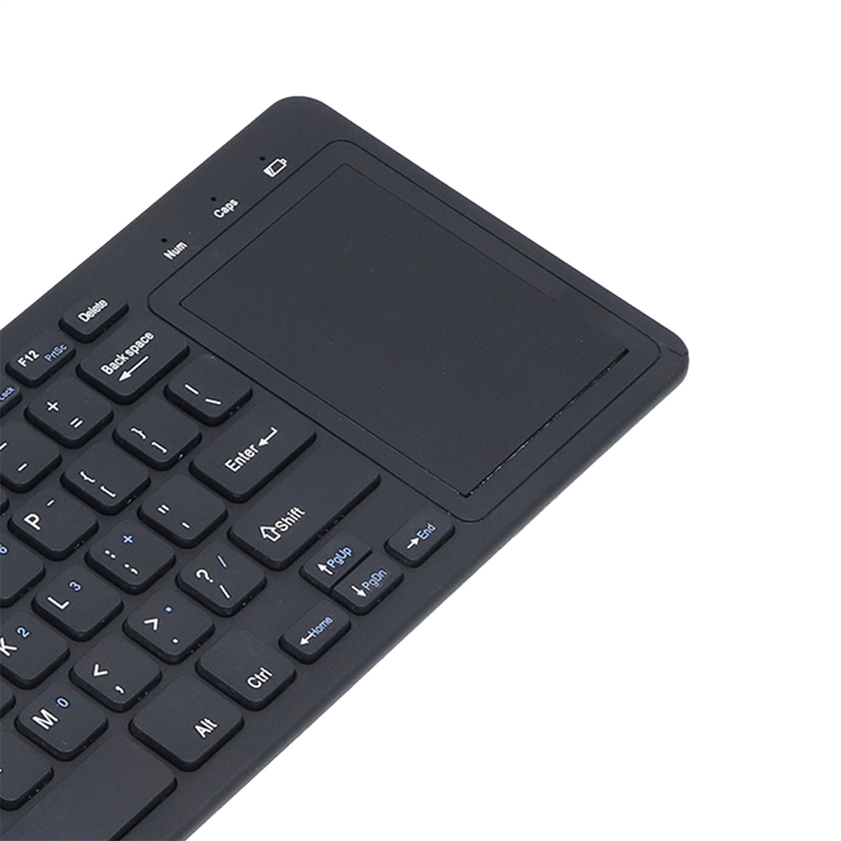 Eine schwarze Tastatur mit Touchpad, die Tasten sind weiß, der Hintergrund ist weiß.