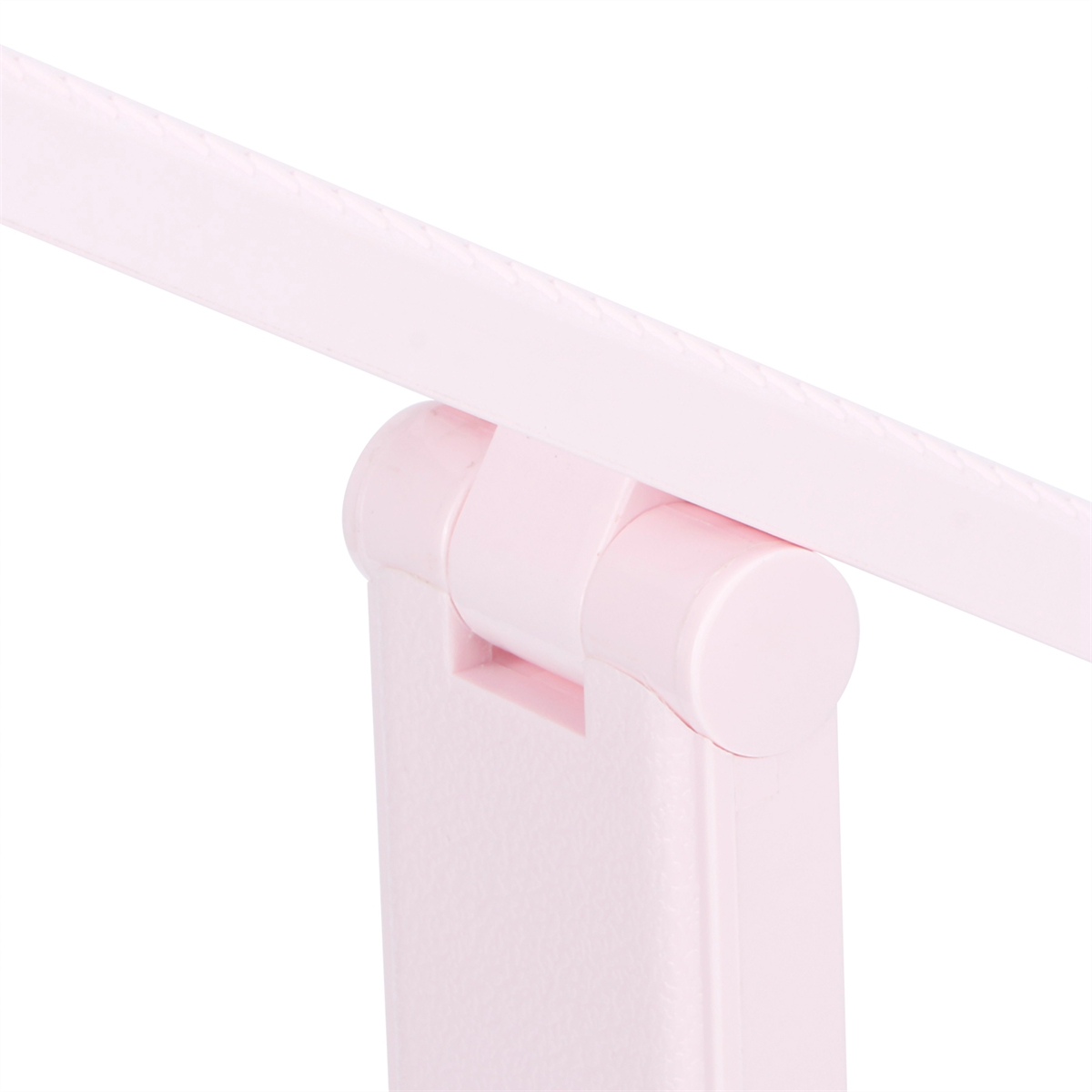 Ein rosa Lampenscharnier. Die Lampe ist zusammengeklappt und scheint aus Kunststoff zu sein. Der Hintergrund ist weiß.