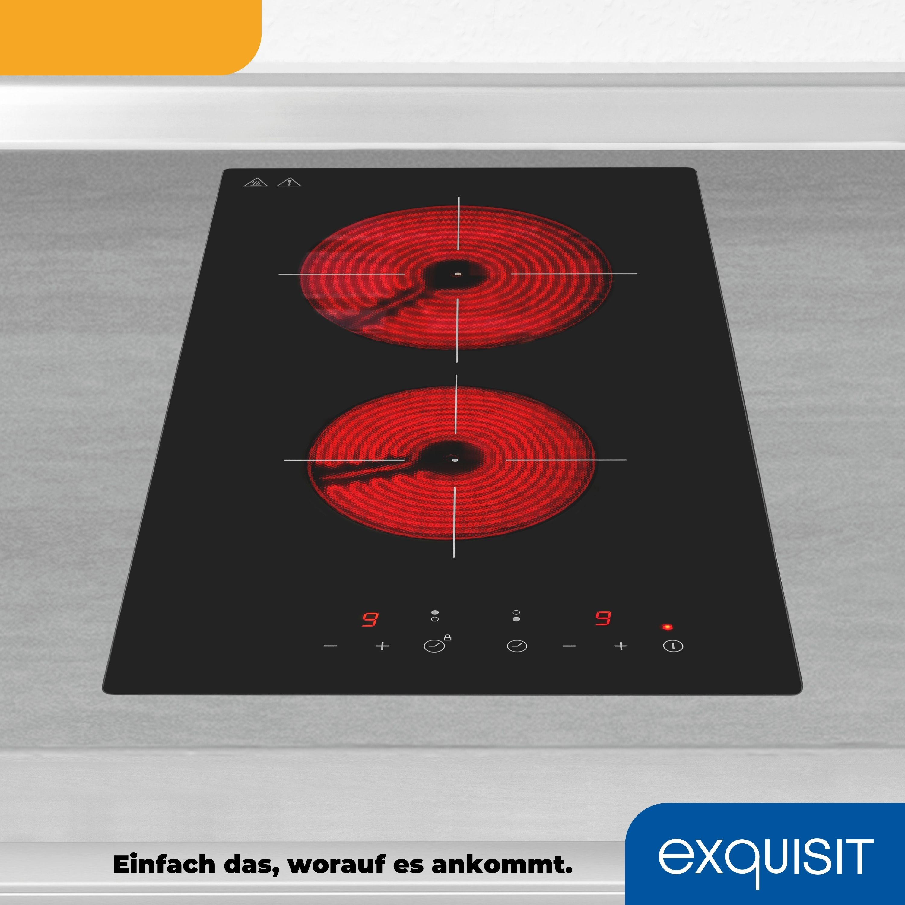 Schwarzer Induktionsherd mit zwei roten Heizelementen. Text: Exquisit.