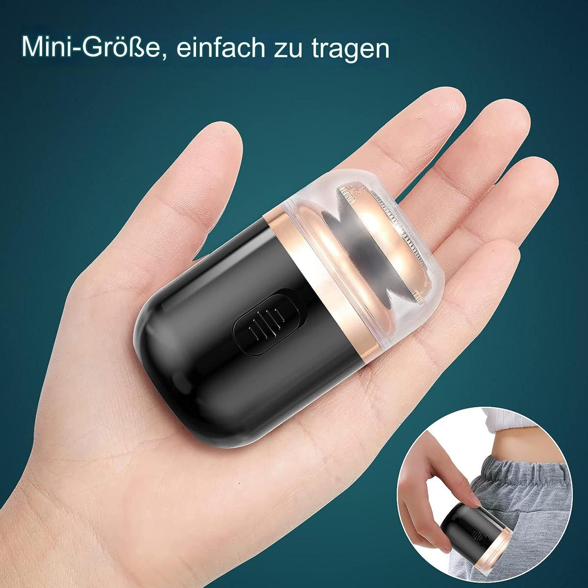 Ein schwarzer und goldener Rasierer in einer Hand. Mini-Größe, einfach zu tragen. Hat eine Schutzkappe.
