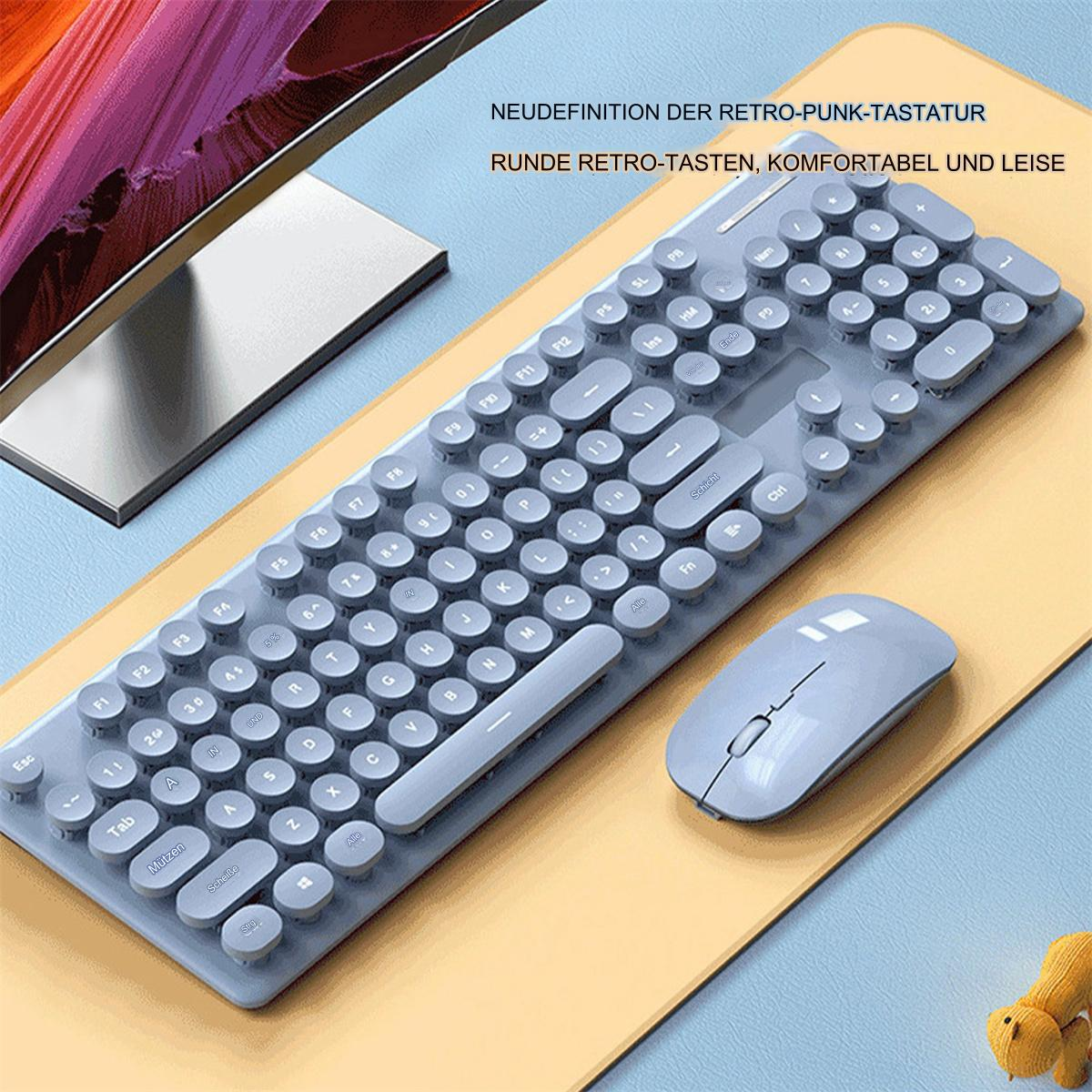 Ein Retro-Tastatur- und Maus-Set in Blau auf einer gelben Matte. Ein Monitor und ein Spielzeug sind sichtbar.