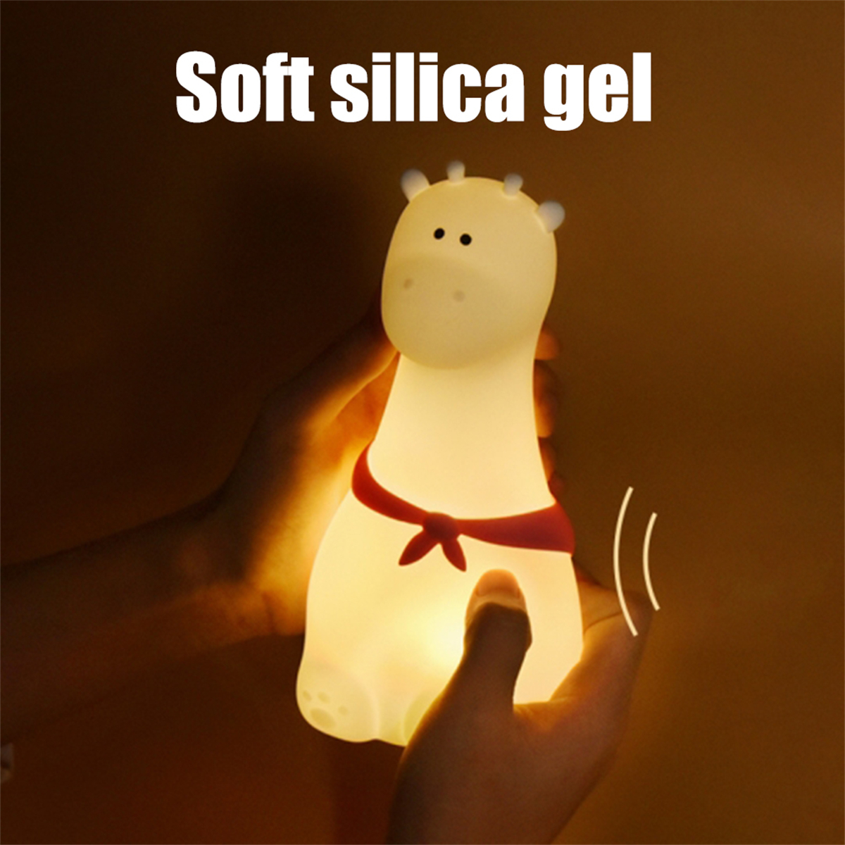 Giraffen-Nachtlicht, leuchtend, in Händen gehalten, mit dem Worten 'Soft silica gel'.